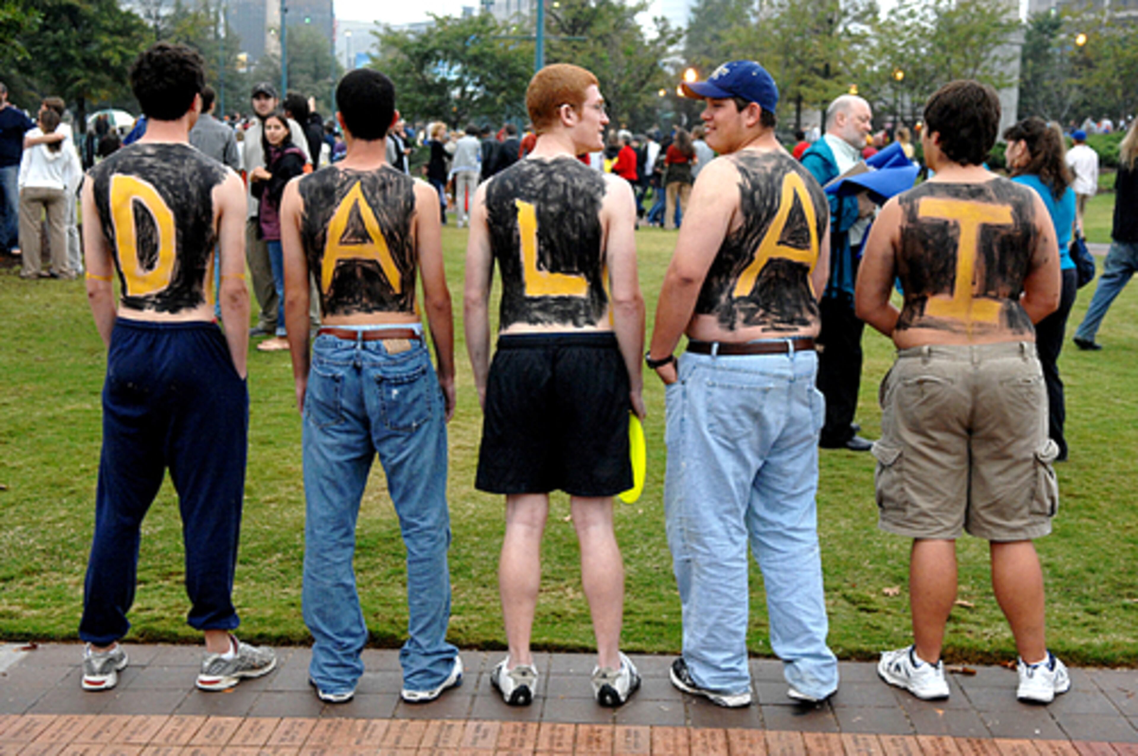 Georgia Tech students (from left) Evan Wollard, Ross Taylor, Ira Kaplan, Chris May and Ryan Hover welcome the spiritual leader. When asked why, Taylor said, "We do this at our football games, so we just wanted to welcome him to Atlanta in our own way."