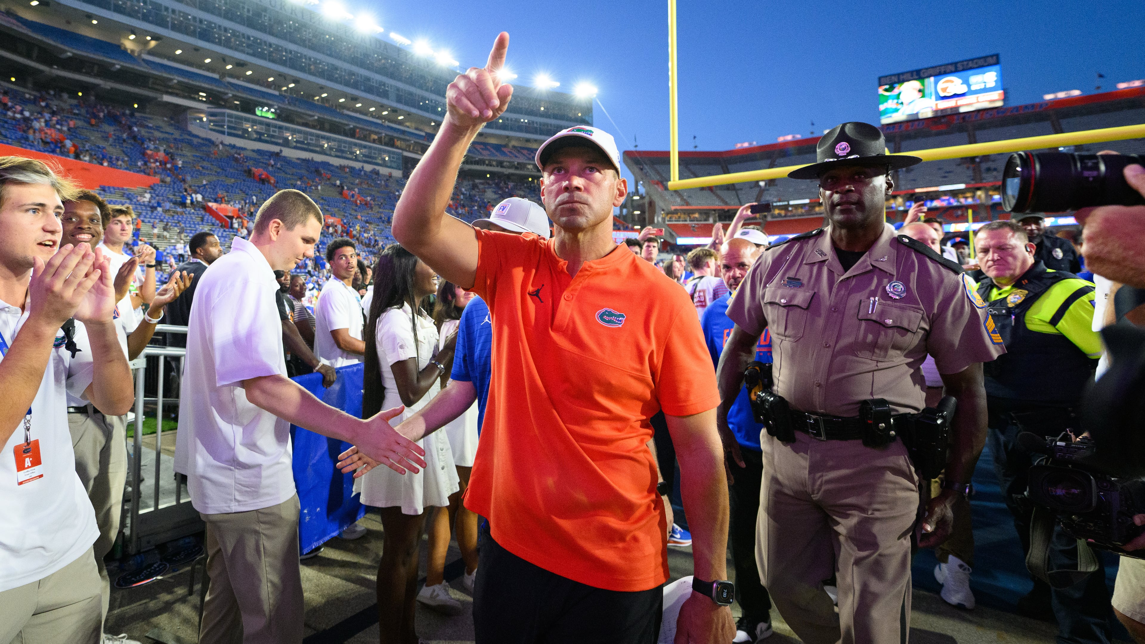 Florida head coach Jon Sumrall walks off the field after winning an NCAA college football game against Mississippi, Saturday, Sept. 26, 2026, in Gainesville, Fla. (AP Photo/Noah Lantor)
