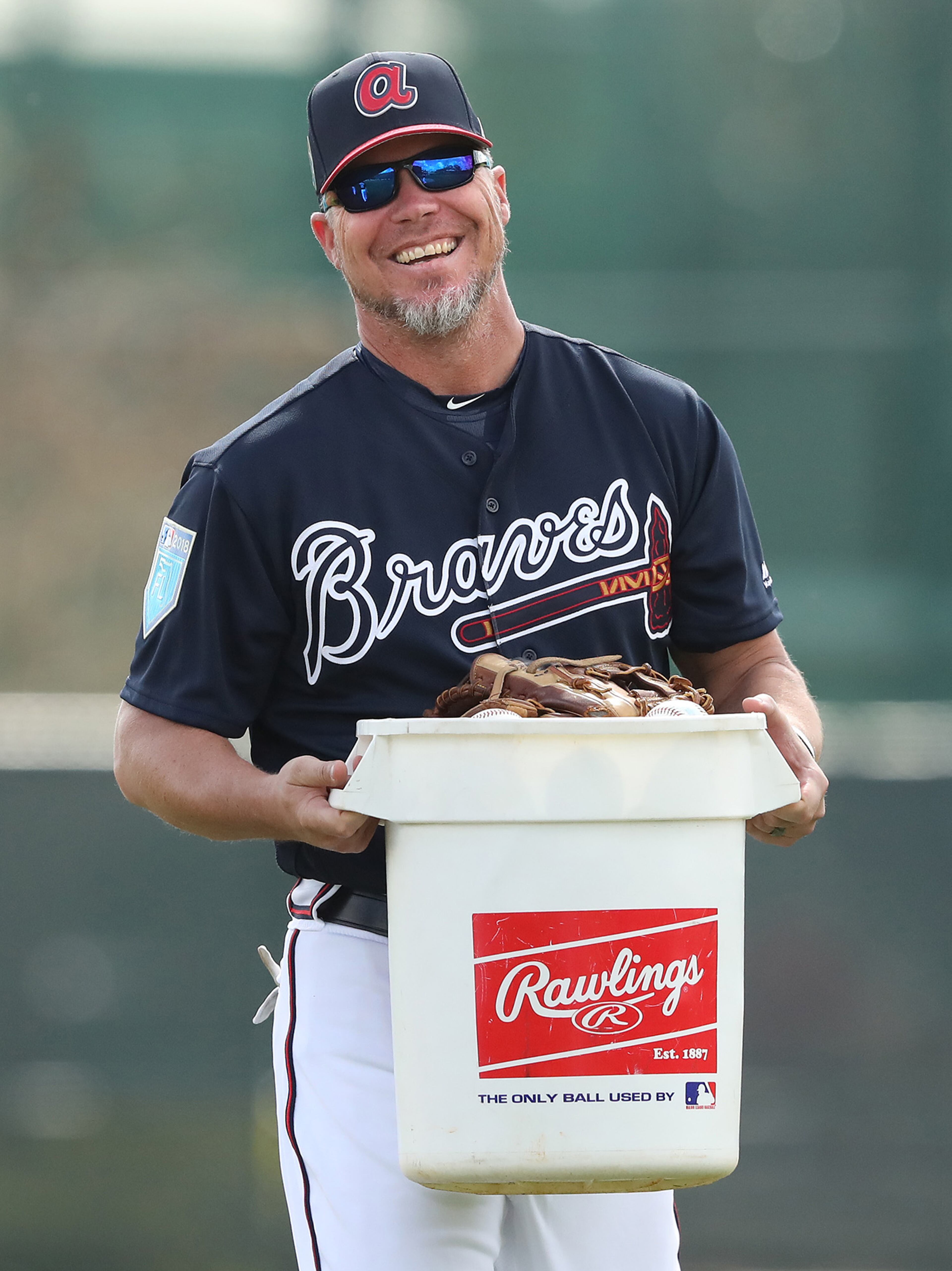 Feb 19, 2018 Lake Buena Vista: Braves recently elected Hall of Fame third baseman Chipper Jones is all smiles pitching in by picking up a bucket of baseballs during batting practice at spring training during the first full squad workout on Monday, Feb 19, 2018, at the ESPN Wide World of Sports Complex in Lake Buena Vista. Jones was helping coach the team for the day. Curtis Compton/ccompton@ajc.com