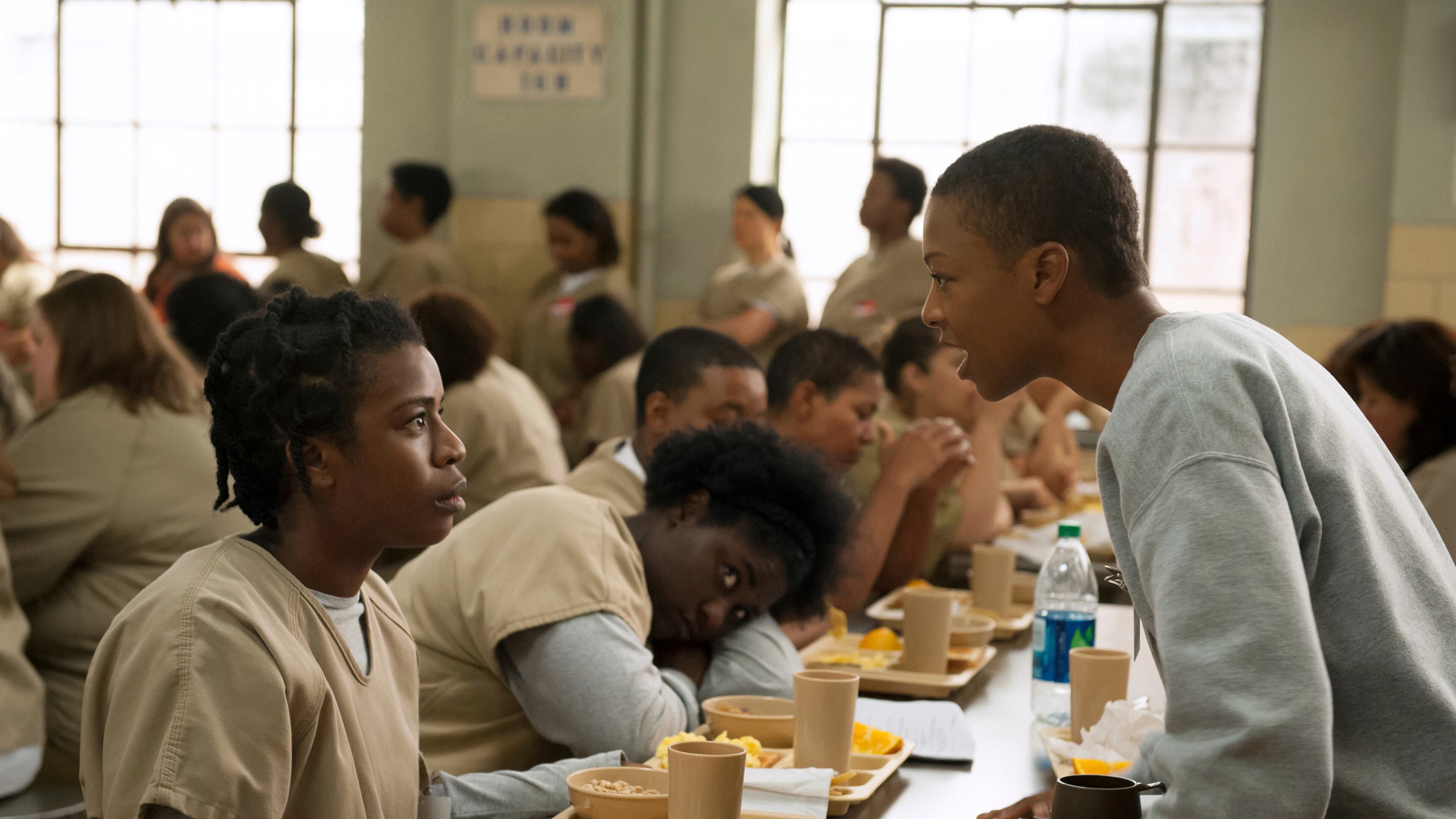 In this file image released by Netflix, Uzo Aduba, left, and Samira Wiley appear in a scene from the Netflix original series “Orange is the New Black.” (Jojo Whilden/Netflix via AP, File)
