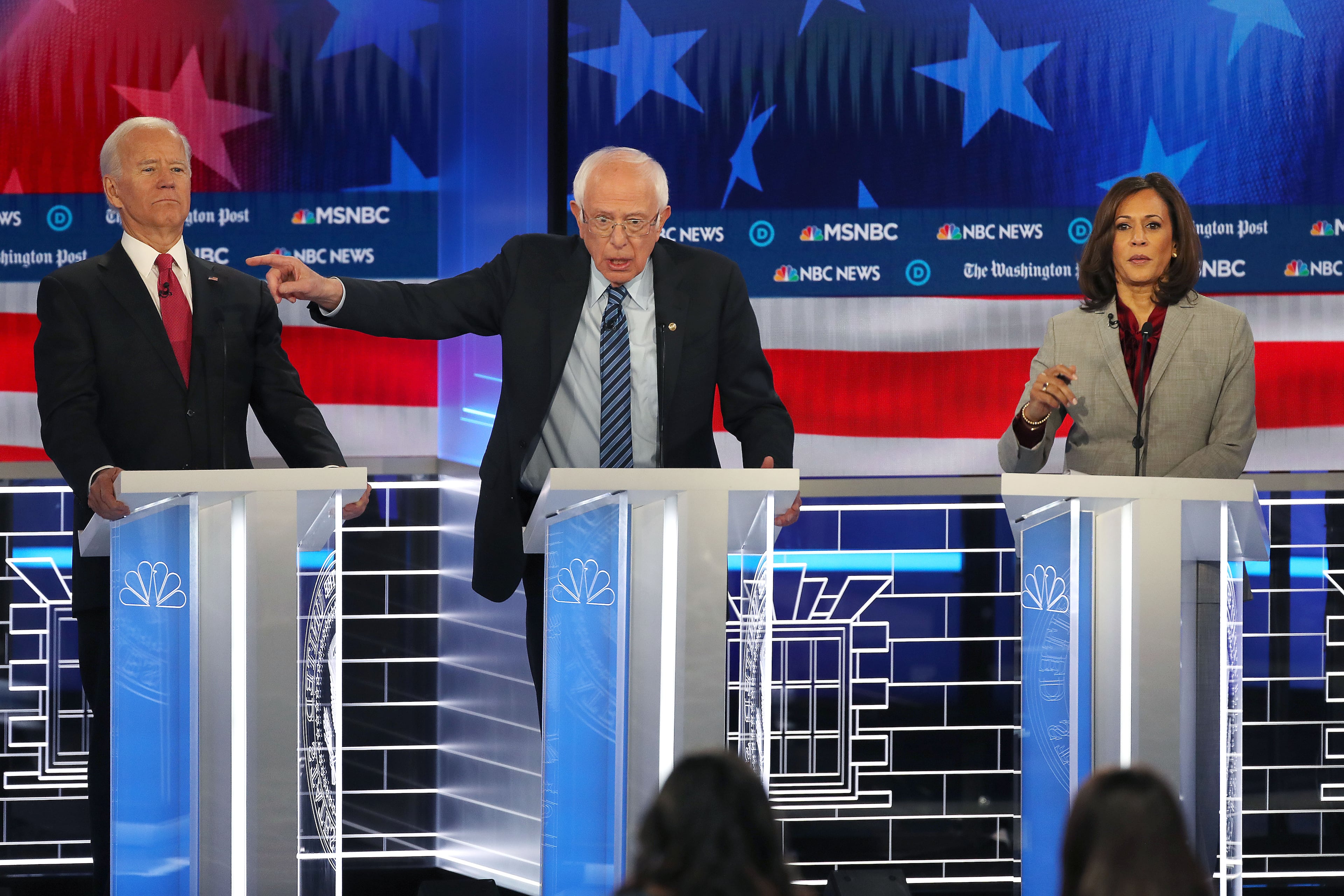11/20/2019 -- Atlanta, Georgia -- Former Vice President Joe Biden (left) clears the way for Senator Bernie Sanders (center) to make a point, during the MSNBC/The Washington Post Democratic Presidential debate inside the Oprah Winfrey Soundstage at Tyler Perry Studios, Monday, November 20, 2019. (Alyssa Pointer/Atlanta Journal Constitution)