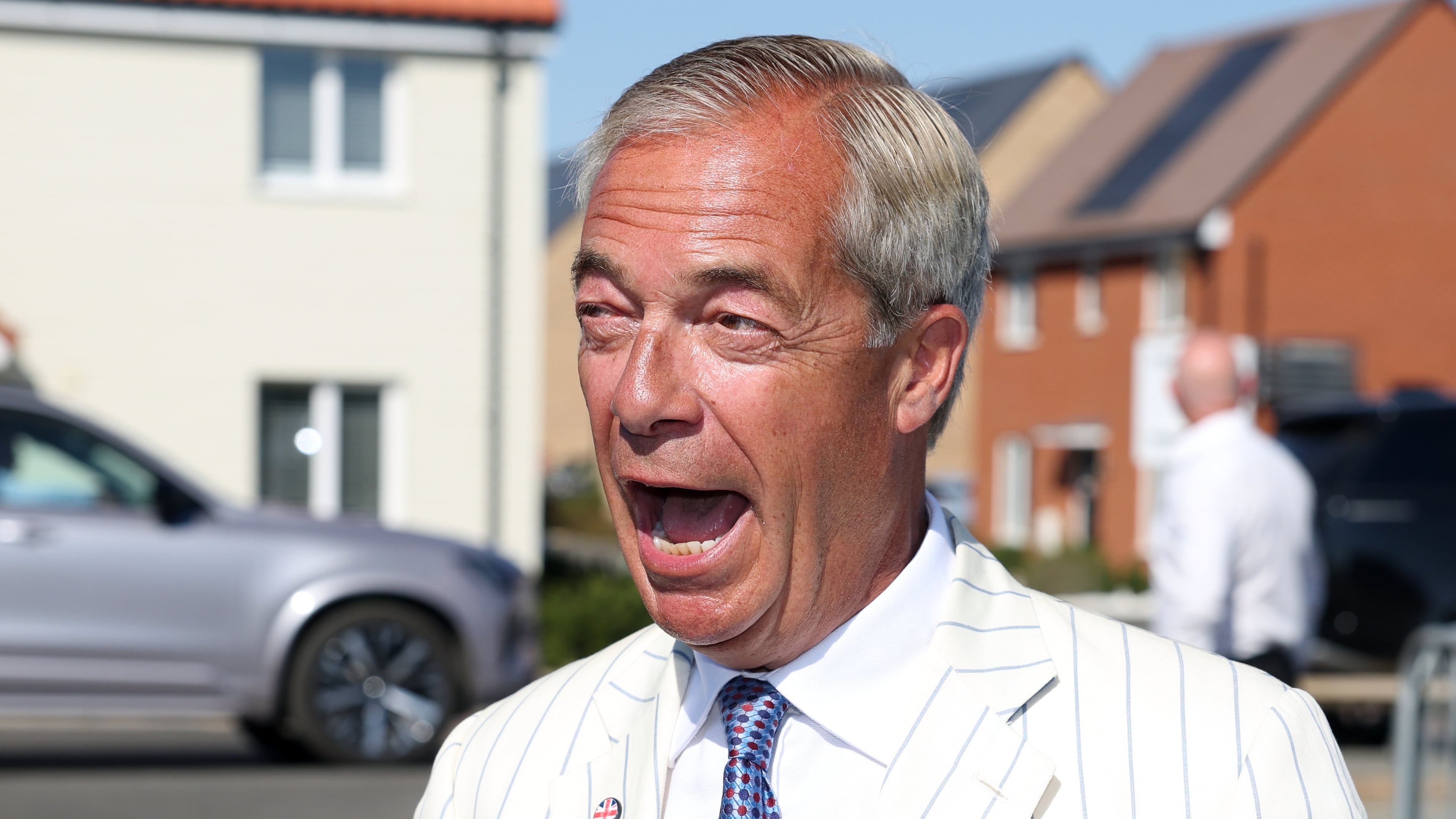 Britain's Reform UK party leader Nigel Farage arrives at a polling station in Walton on the Naze, Thursday, Aug. 13, 2026 to cast his vote for the Clacton on Sea by-election.(AP Photo/Richard Pelham)