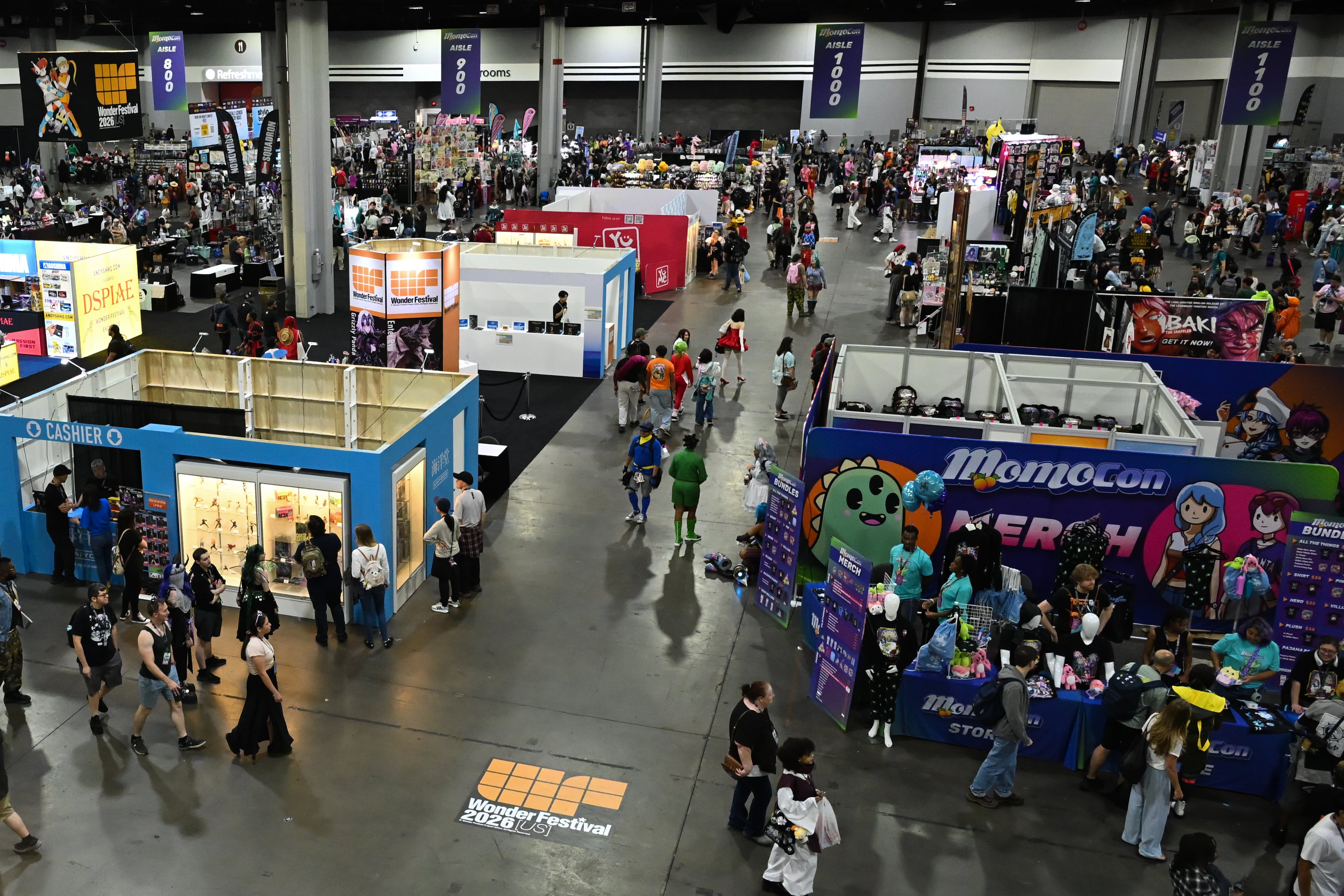 Attendees visit vendor booths during MomoCon at the Georgia World Congress Center in Atlanta on Friday, May 22, 2026. (Tyler Sun for the AJC)