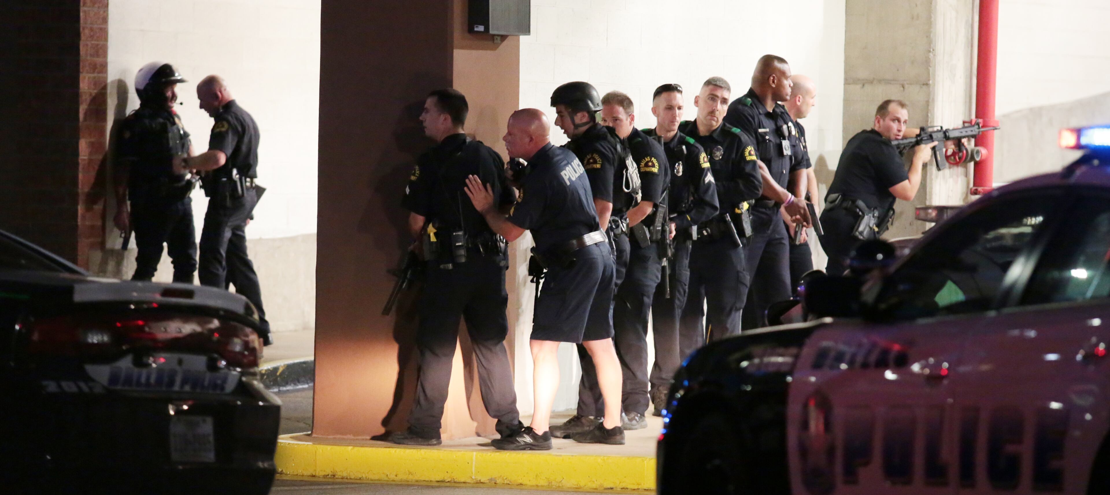 Dallas Police respond after shots were fired during a protest of fatal police shootings earlier this week in Louisiana and Minnesota, Thursday, July 7, 2016, in Dallas. Snipers opened fire on police officers during the protests; several officers were killed, police said. (Maria R. Olivas/The Dallas Morning News via AP)
