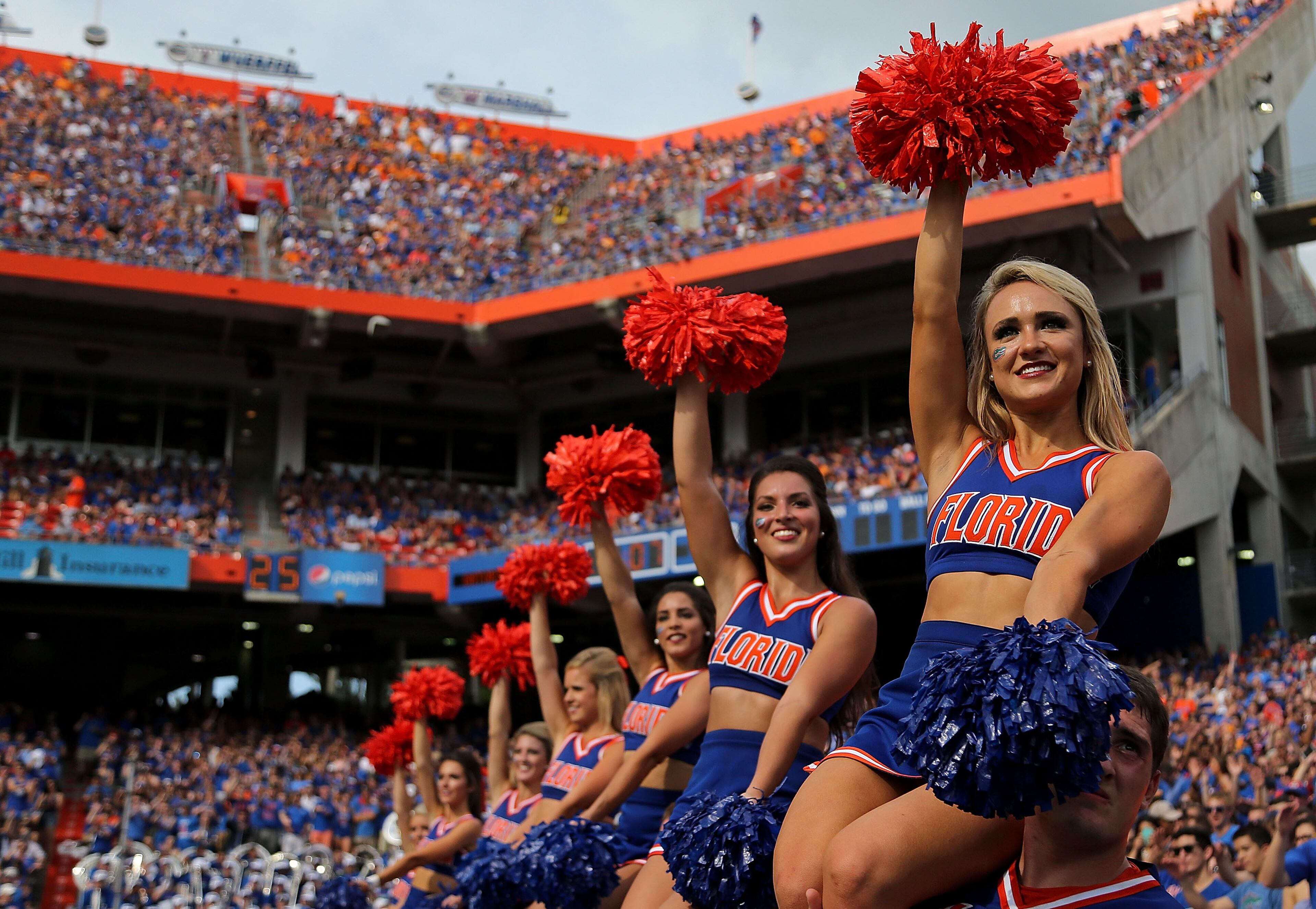 The Florida Gators cheerleadrs cheer during a game against the Tennessee Volunteers at Ben Hill Griffin Stadium on September 26, 2015 in Gainesville, Florida. (Photo by Mike Ehrmann/Getty Images)