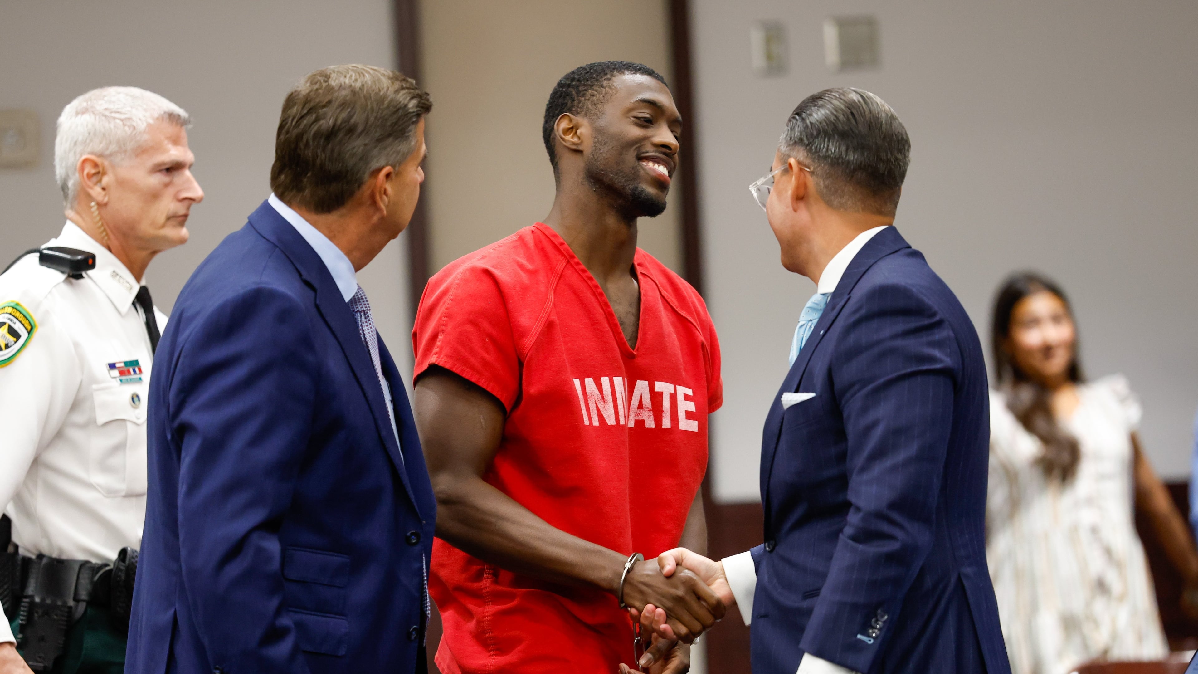 Terrion Arnold, a Detroit Lions cornerback, shakes hands with his attorneys R. Timothy Jansen, left, and A.J. Alvarez, during the conclusion of his pretrial detention hearing at the Hillsborough County Courthouse on Monday, June 29, 2026, in Tampa, Fla. (Jefferee Woo/Tampa Bay Times via AP)