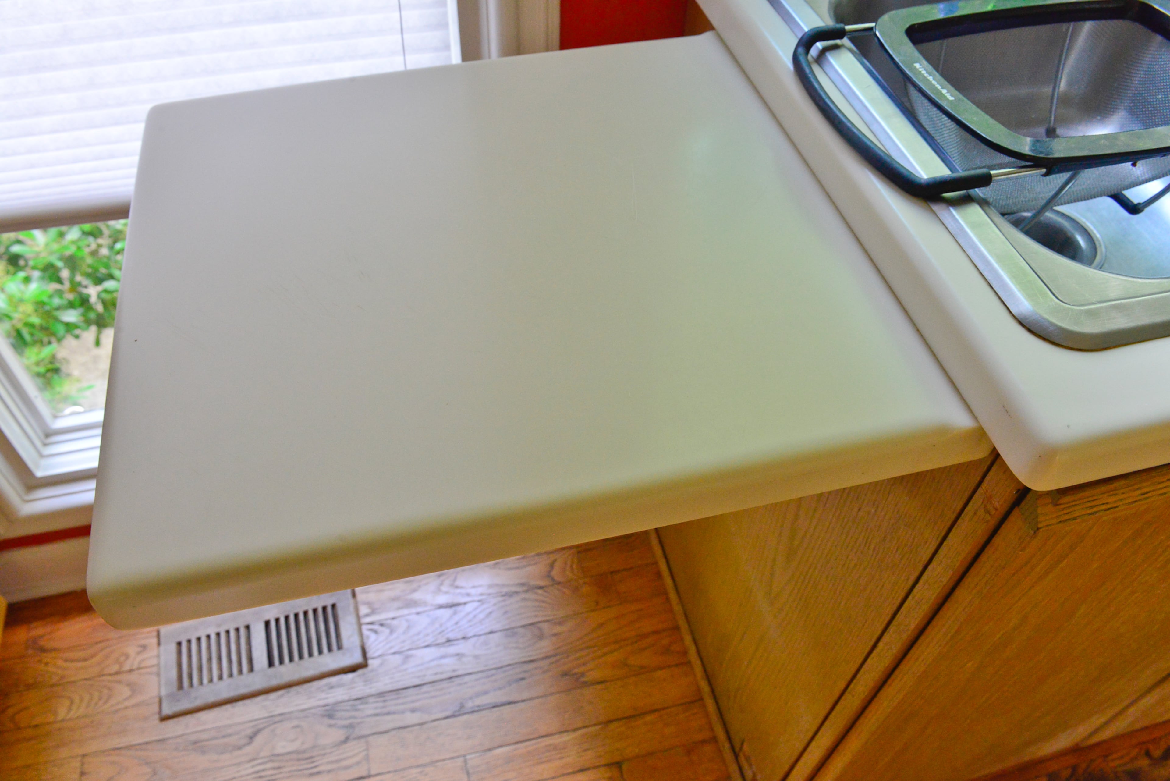 Judy Mozen built her modern home in 1986. While the kitchen renovations are still under way and new countertops are coming soon, this nifty counter extension raises to give the avid cook extra prep space and then folds flat against the cupboards when not needed.