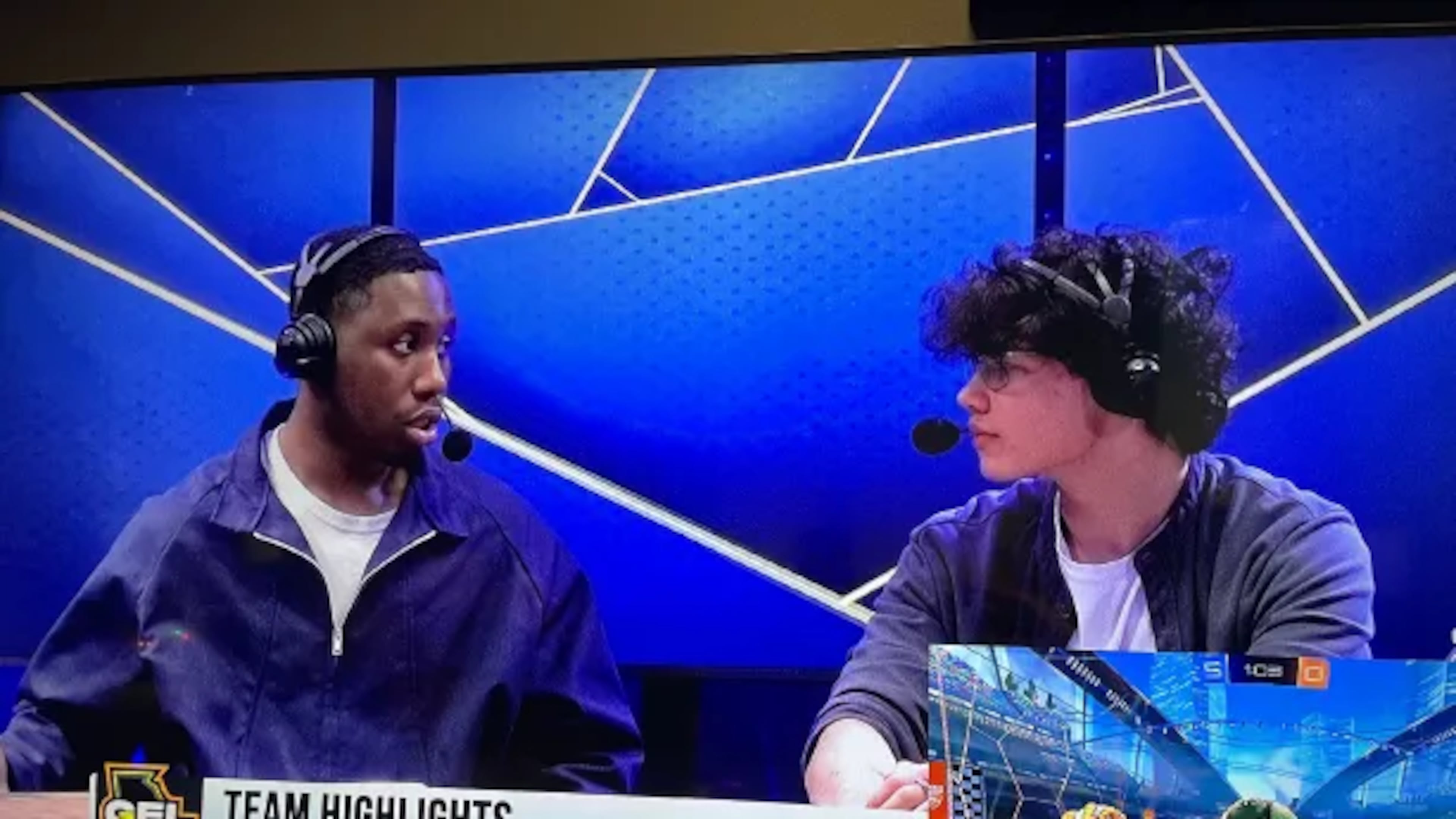 College students at the Skillshot esports analyst desk comment on the Georgia Esports League competition between rivals Georgia Tech and the University of Georgia in the game Rocket League.