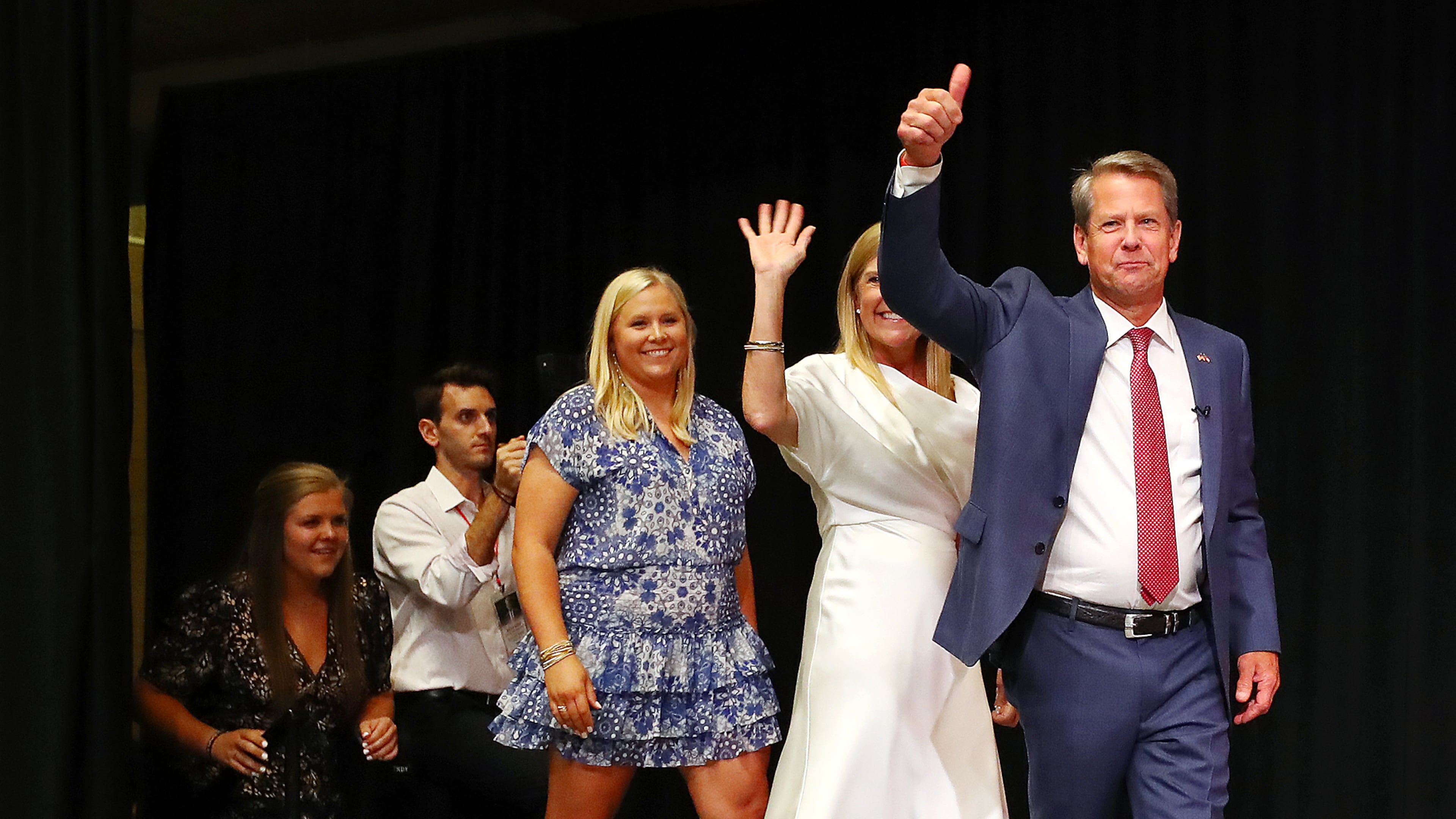 Gov. Brian Kemp gives a thumbs up as he takes the stage with his family to deliver his victory speech in the Georgia primary. After defeating former U.S. Sen. David Perdue in the primary by about 52 percentage points, Kemp has seen some of his former opponents line up behind him ahead of November's contest with Democrat Stacey Abrams. (Curtis Compton / Curtis.Compton@ajc.com)