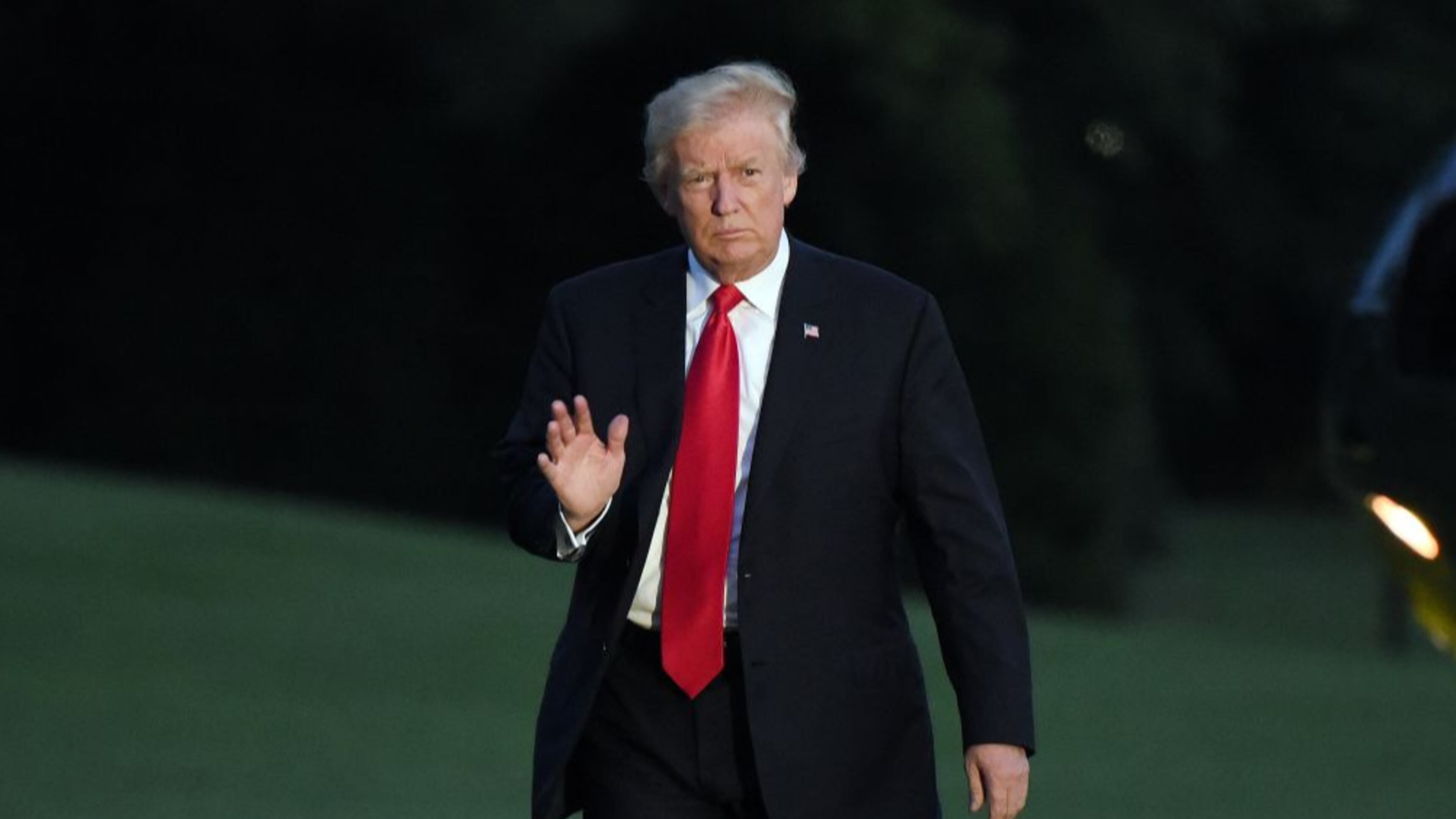 President Donald Trump waves as he returns to the White House on July 8, 2017 in Washington, DC. (Photo by Olivier Douliery - Pool/Getty Images)