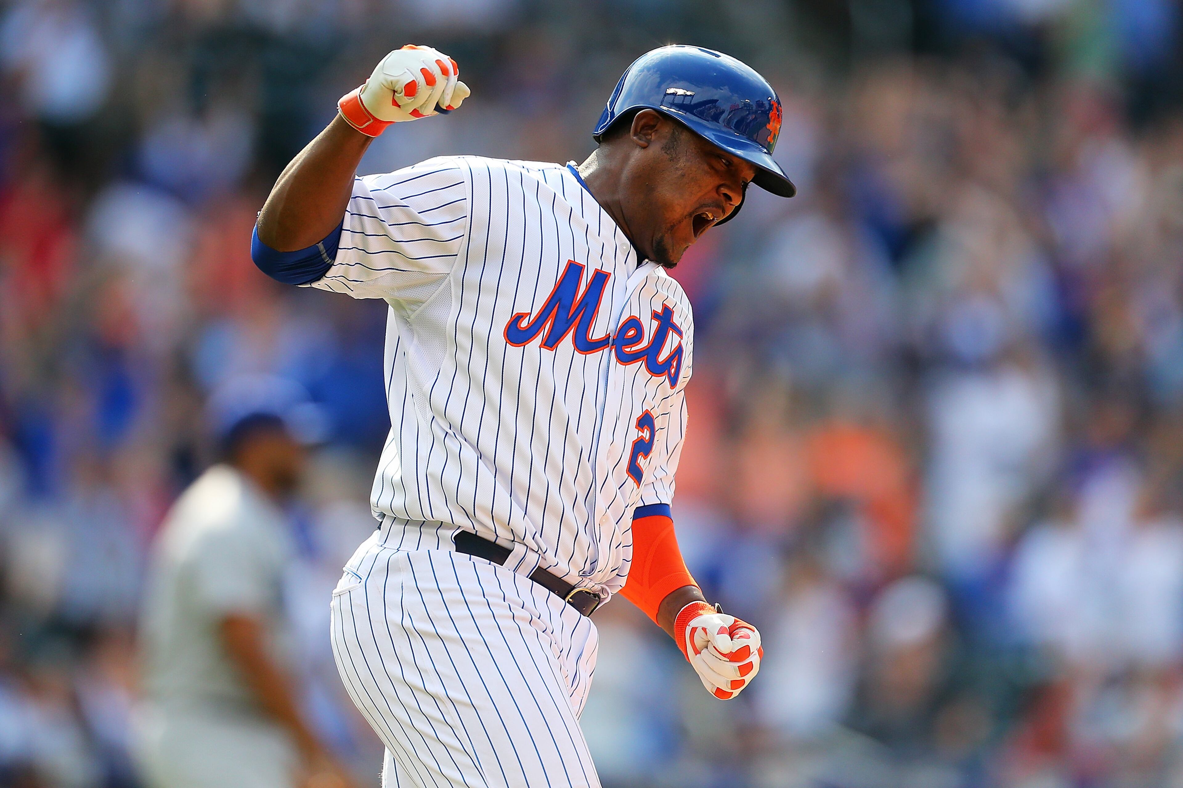 Juan Uribe #2 of the New York Mets celebrates after hitting a game winning walk-off RBI single against the Los Angeles Dodgers in the tenth inning at Citi Field on July 26, 2015 in Flushing neighborhood of the Queens borough of New York City. Mets defeated the Dodgers 3-2 in ten inning. (Photo by Mike Stobe/Getty Images)