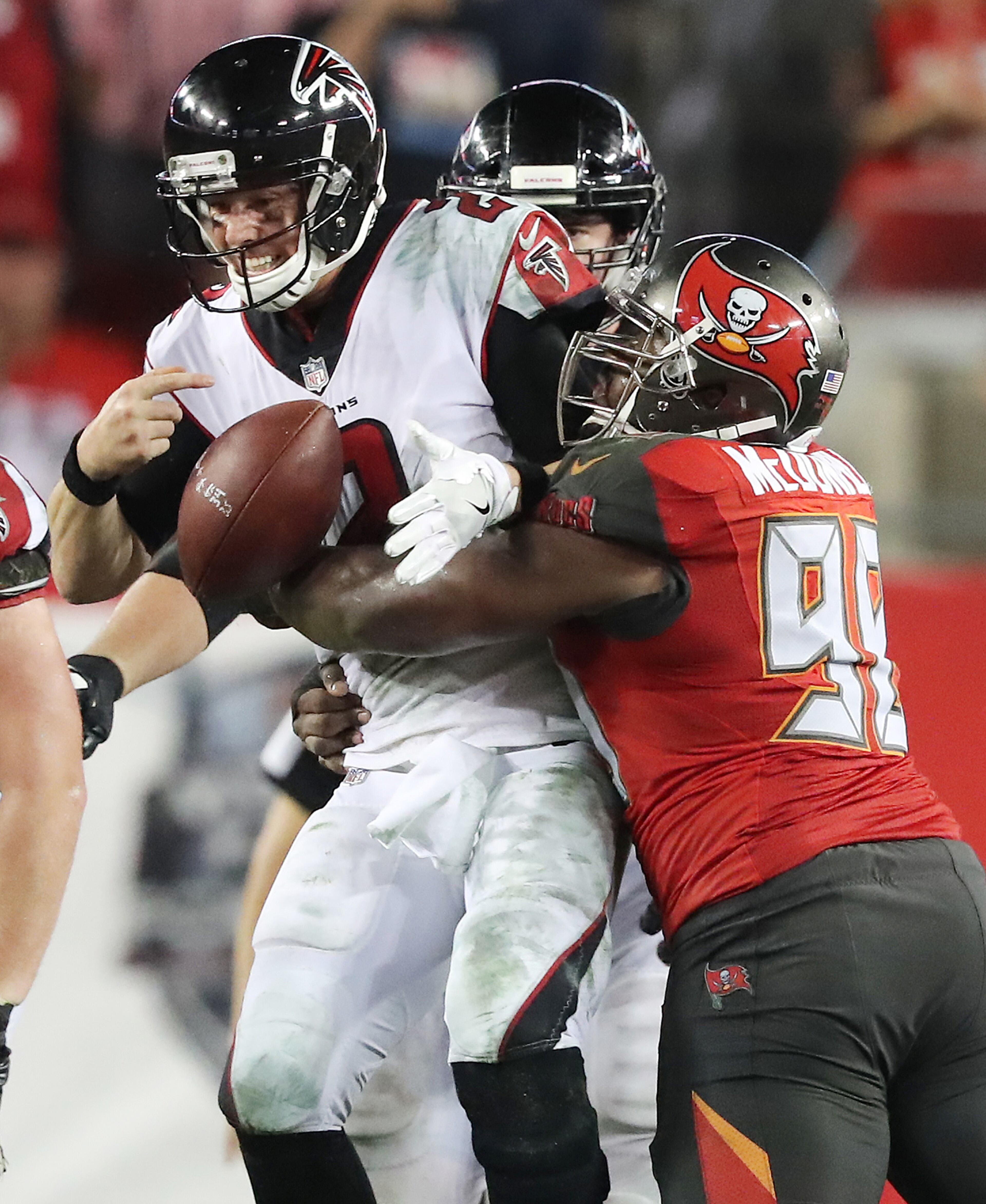 December 18, 2017 Tampa: Falcons quarterback Matt Ryan barely holds on to the football on a sack by Buccaneers Clinton McDonald during a third down play in the final minutes of a NFL football game on Monday, December 18, 2017, in Tampa. The Falcons held on to beat the Bucs 24-21. Curtis Compton/ccompton@ajc.com