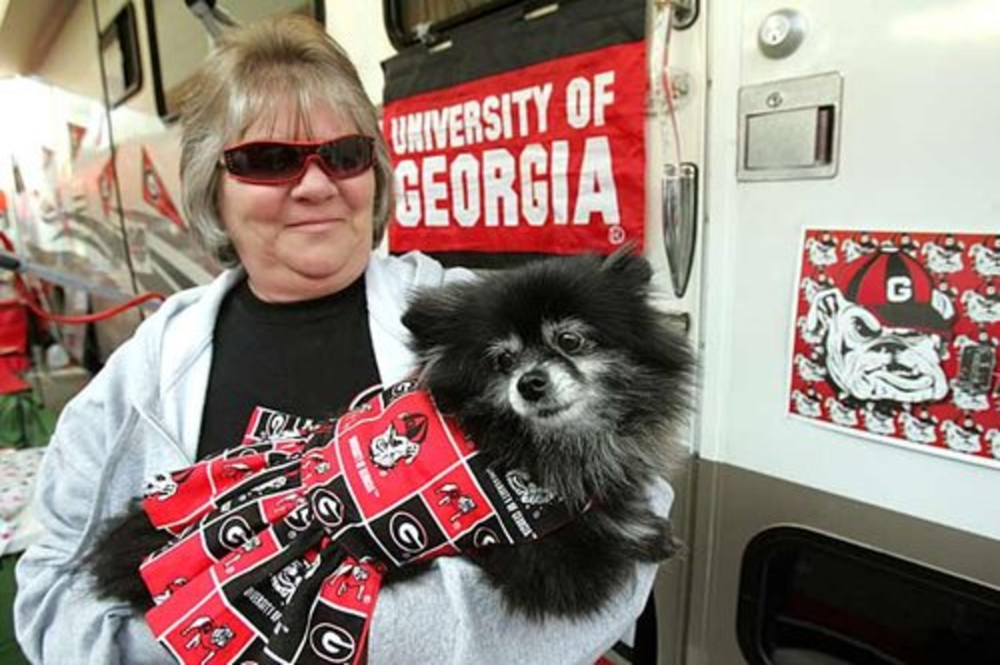 Barbara Ellerbee, from Griffin, shows off her 7-year-old pomeranian, "Bella", decked out in Georgia garb.