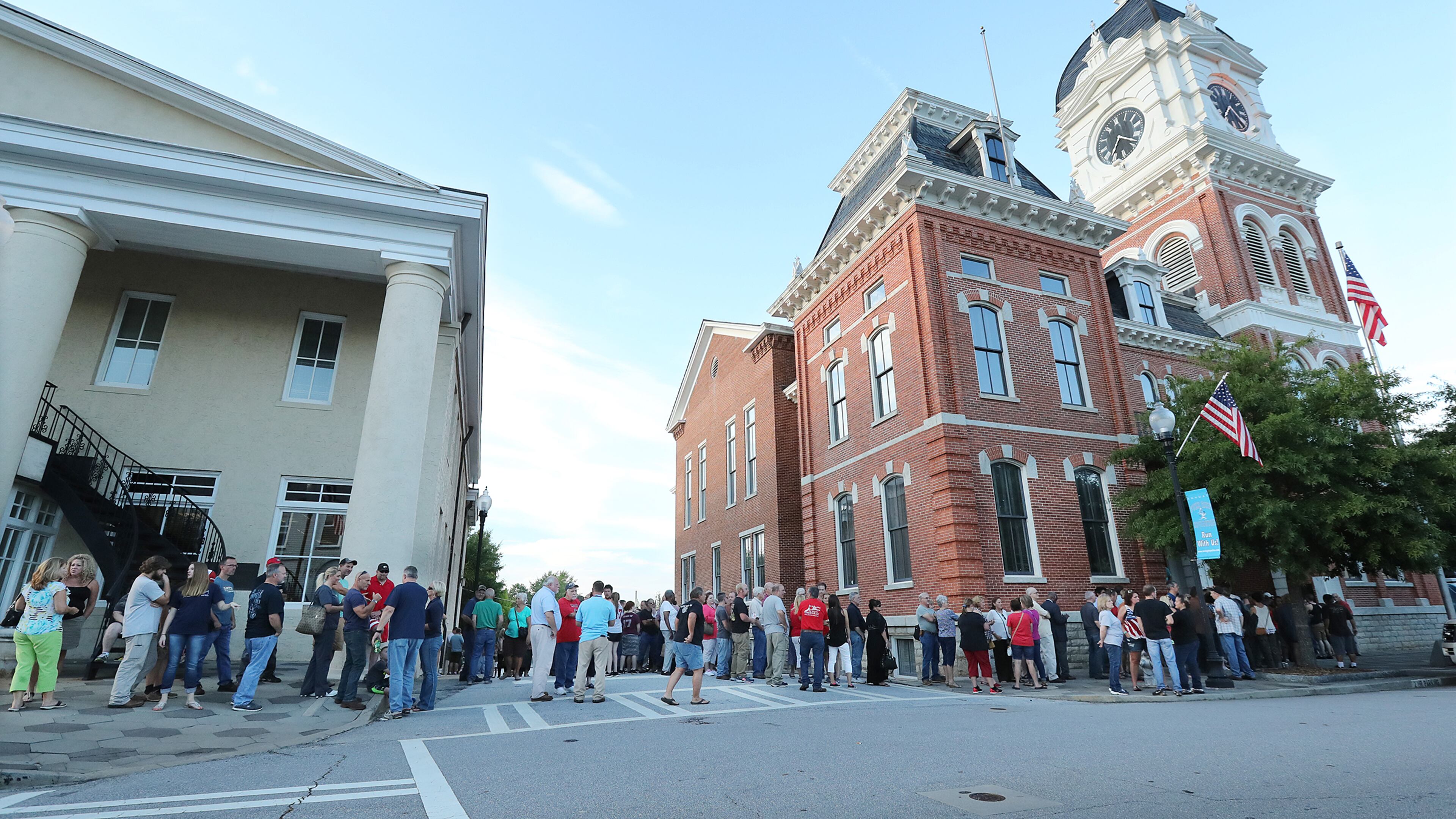 Hundreds of Newton County residents wait in line outside the historic courthouse for the second of two town hall meetings of the night, due to overflow crowds, on plans to build a mosque and cemetery in the county on Monday. Curtis Compton, ccompton@ajc.com