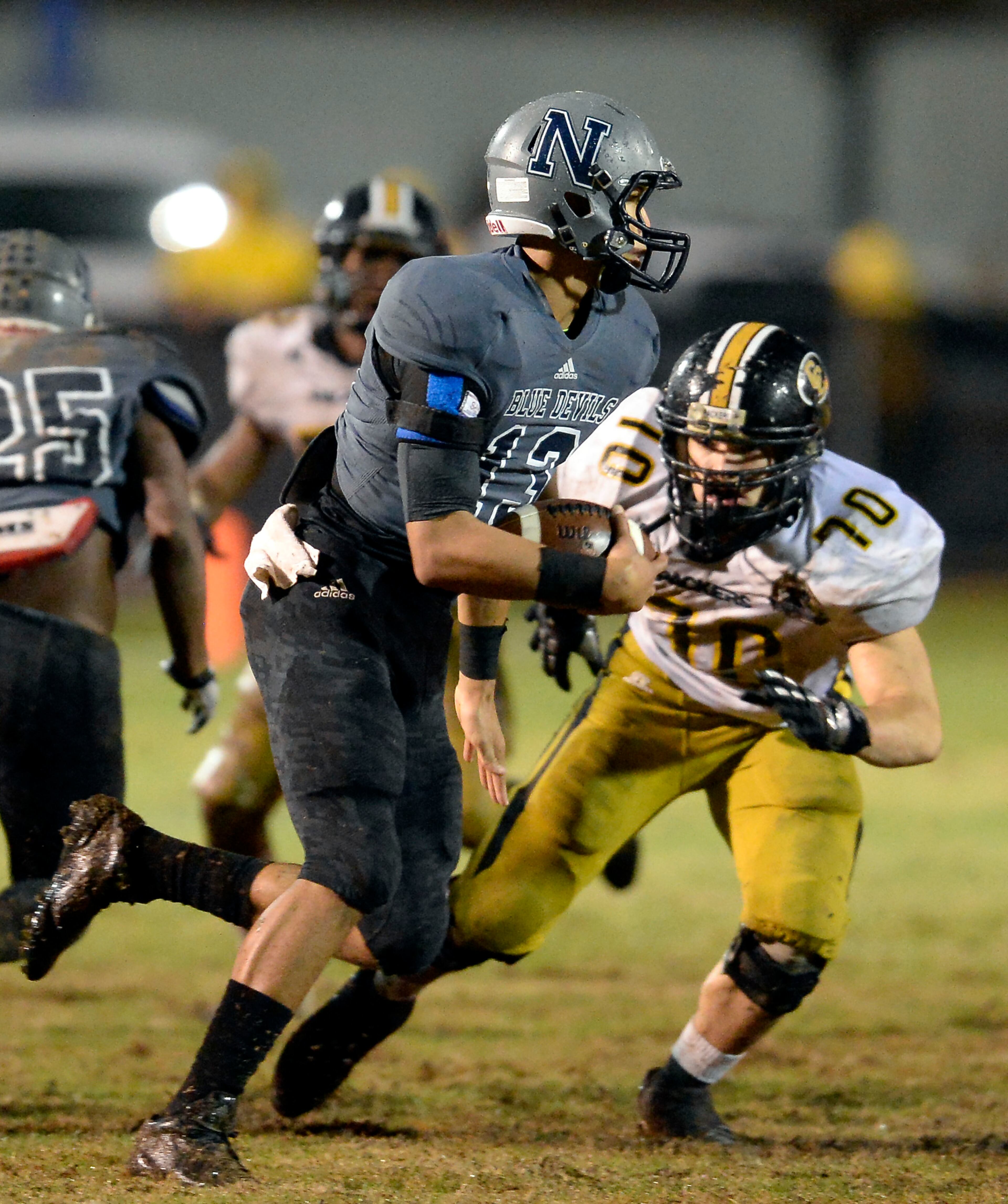 Norcross defensive back Jordan Noil (13) runs the interception deep into the red-zone to end any chance of a Colquitt comeback with less than a minute to play in the second half of their AAAAAA semifinal game at Blue Devil Stadium on Friday, Dec. 6, 2013, in Norcross, Ga.