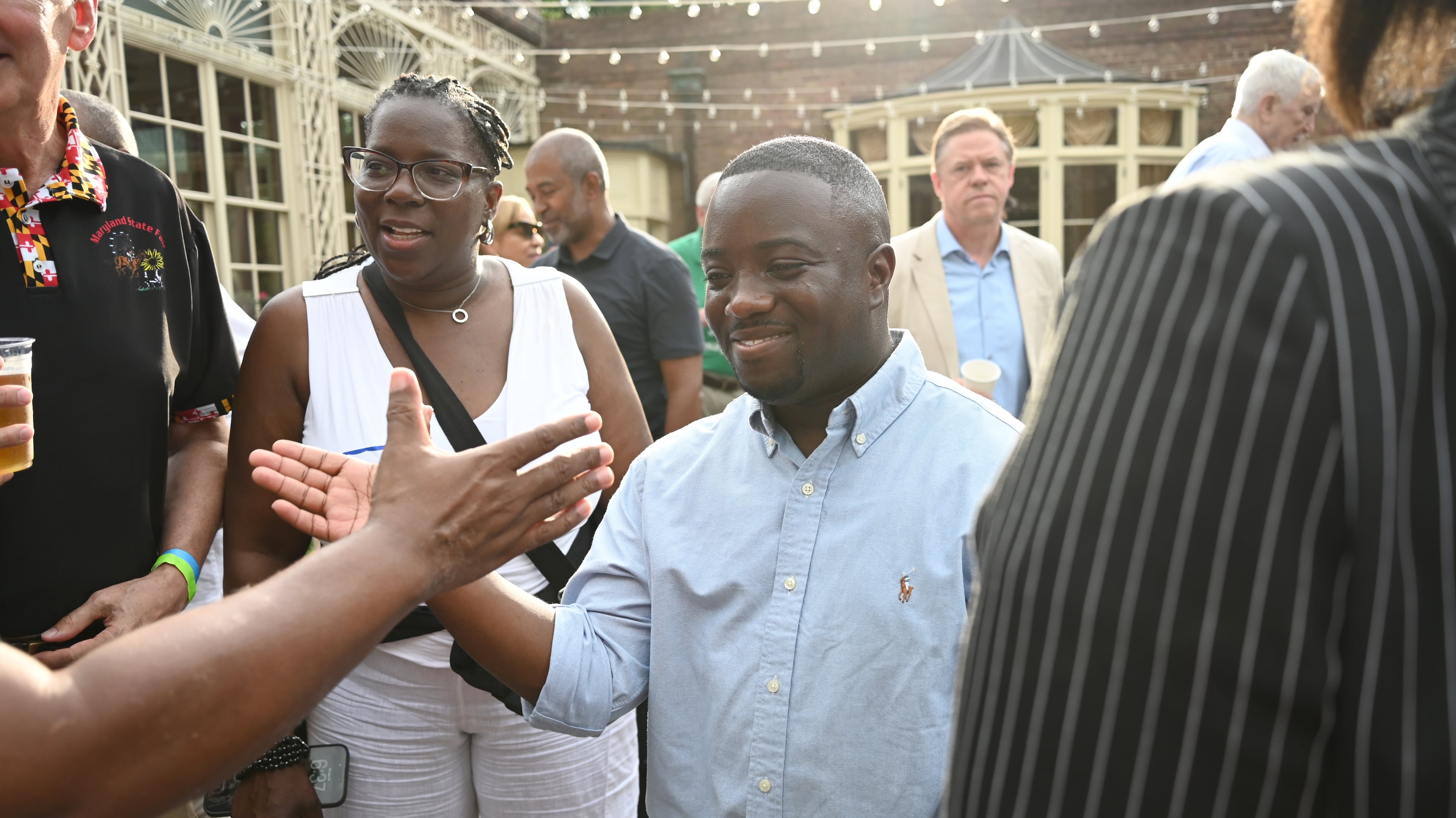 Adrian Boafo, a Maryland state delegate and candidate for U.S. Congress greets supporters at the "AmeriPac Bull Roast" Friday, June 12, 2026, in Mitchellville, Md. (AP Photo/Gail Burton)