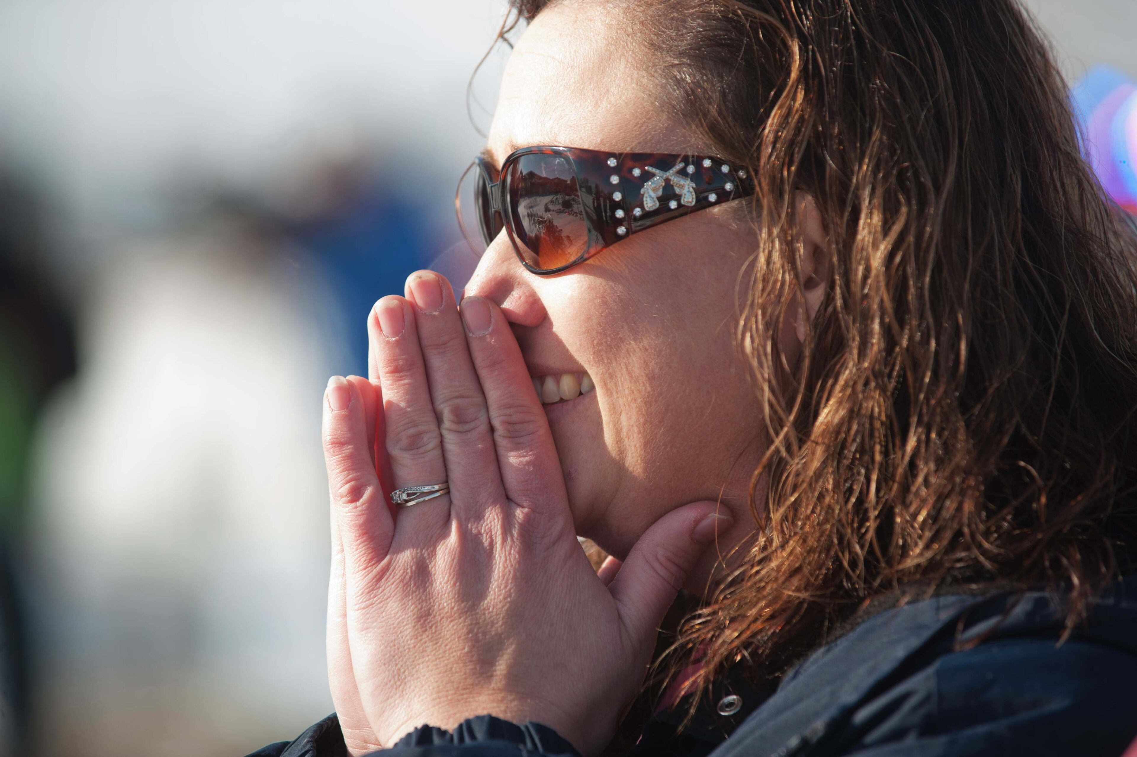 Connie Gottschalk a close family friend watches as rescue personnel unload a family at Pershing General Hospital who were were found safe in a remote mountain range northeast of Reno, in Lovelock, Nevada, December 10, 2013. A Nevada couple and four young children reported missing on Sunday were found safe by rescue workers on Tuesday huddled in a canyon, a dispatch supervisor for the Pershing County Sheriff's Office said. REUTERS/James Glover