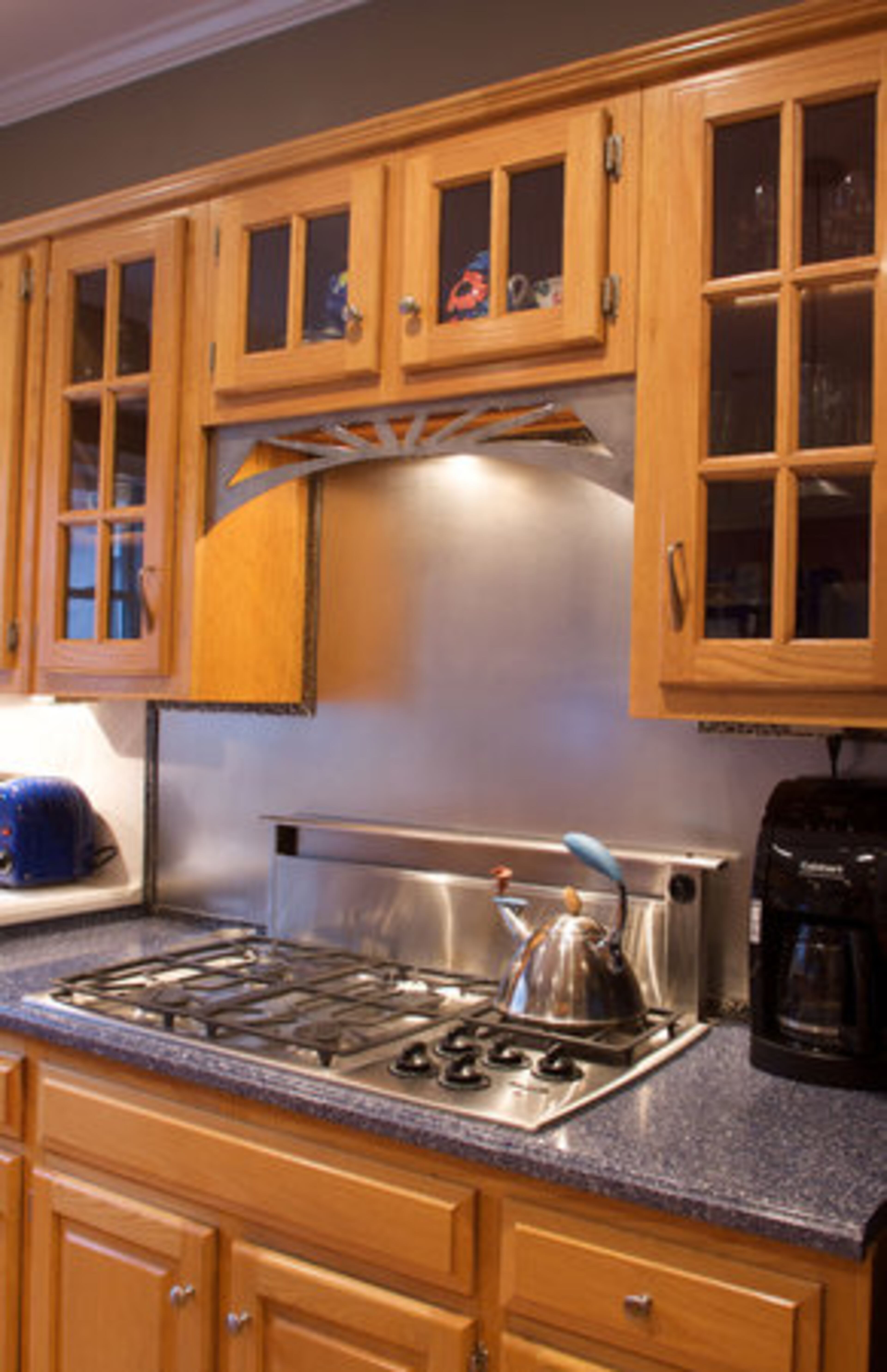 "One of our renovations was the kitchen," Kathy Graivier says. "We left the cabinetry alone but decided to change the countertops and add a walk-in pantry."