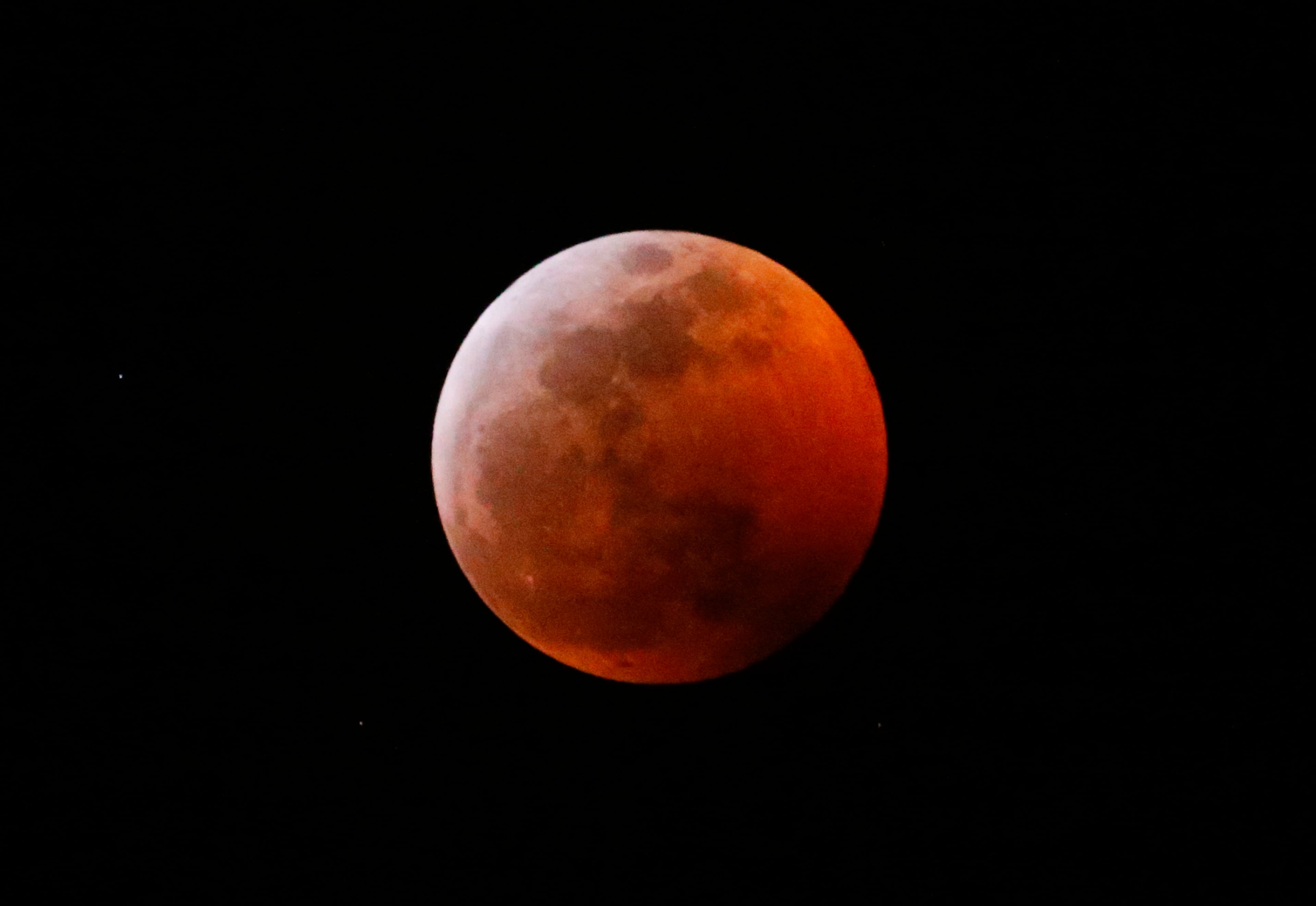 This photo shows the moon during a total lunar eclipse, seen from Los Angeles, Sunday Jan. 20, 2019. The entire eclipse will exceed three hours. Totality - when the moon's completely bathed in Earth's shadow - will last an hour. Expect the eclipsed, or blood moon, to turn red from sunlight scattering off Earth's atmosphere. (AP Photo/Ringo H.W. Chiu)