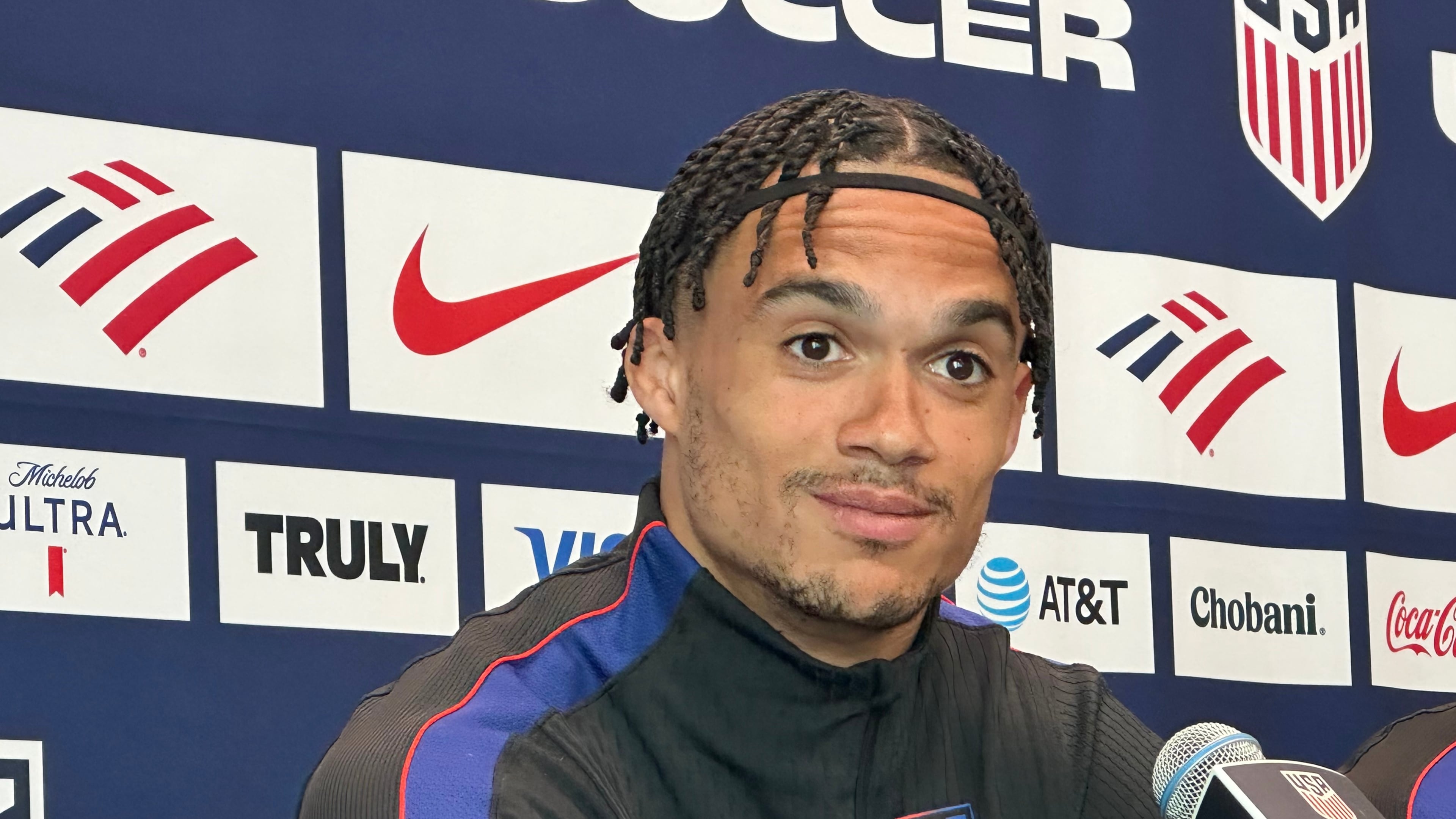 Unites States' Antonee Robinson listens during a news conference before the men's national soccer team training, Friday, March 27, 2026, in Marietta, Ga. (AP Photo/Ronald Blum