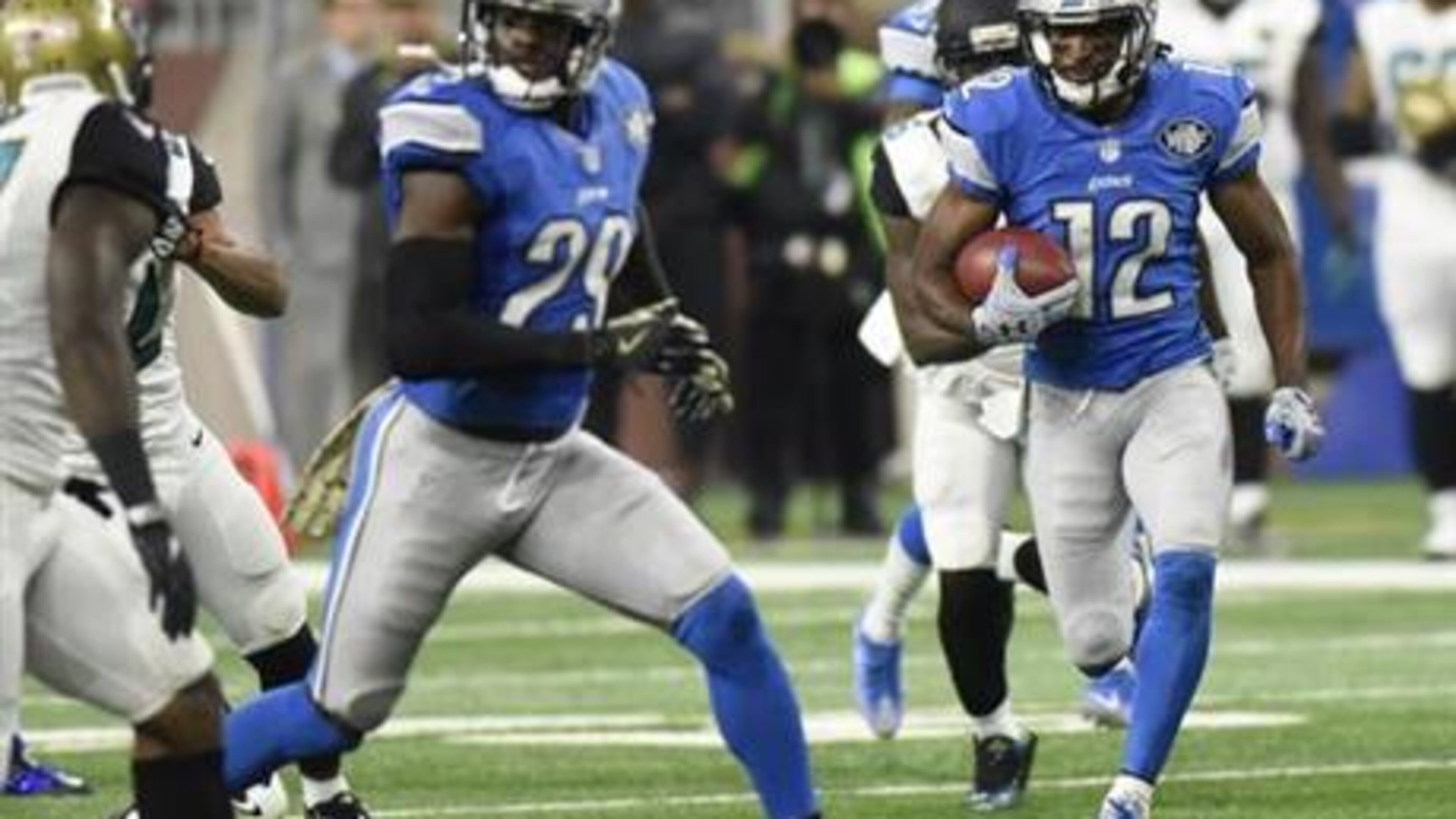 Detroit Lions wide receiver Andre Roberts (12) returns a punt for a 55-yard touchdown during the first half of an NFL football game against the Jacksonville Jaguars, Sunday, Nov. 20, 2016 in Detroit. (AP Photo/Jose Juarez)