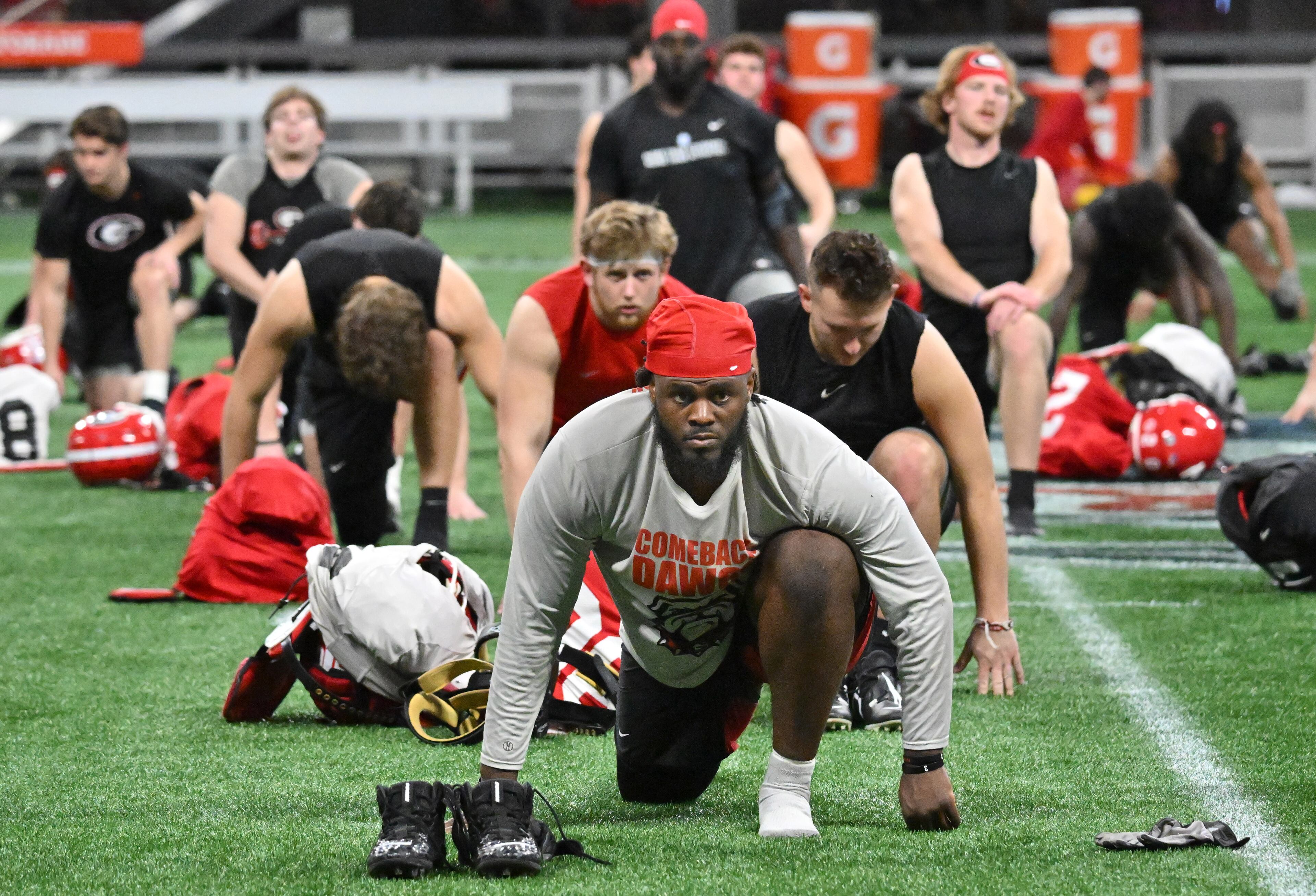 Georgia players stretch during a practice session for the Chick-fil-A Peach Bowl game against Ohio State at the Mercedes-Benz Stadium on Thursday, Dec. 29, 2022, in Atlanta. (Hyosub Shin / Hyosub.Shin@ajc.com)