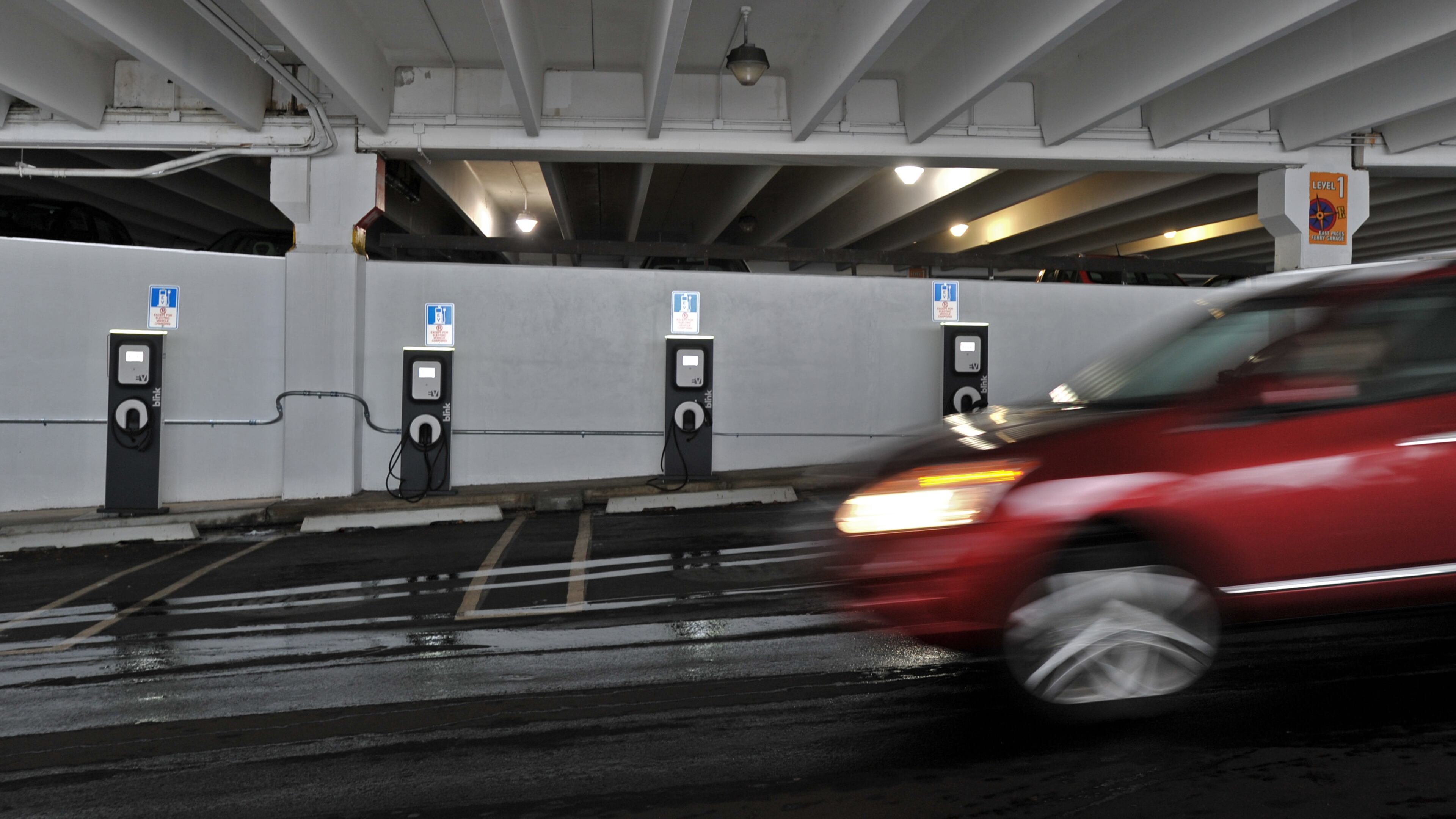 January 15, 2013 Atlanta - This picture was taken at the electric vehicle charging stations on the lower level of the Bloomingdales' parking at Lenox Square Mall on Tuesday, Jan. 15, 2013. Hundreds of chargers for electric cars are being installed in car-centric metro Atlanta, all part of a broader push to find ways to ease pollution and reduce gasoline demand. HYOSUB SHIN / HSHIN@AJC.COM Electric vehicle charging stations on the lower level of the Bloomingdales' parking at Lenox Square Mall. Hyosub Shin, hshin@ajc.com