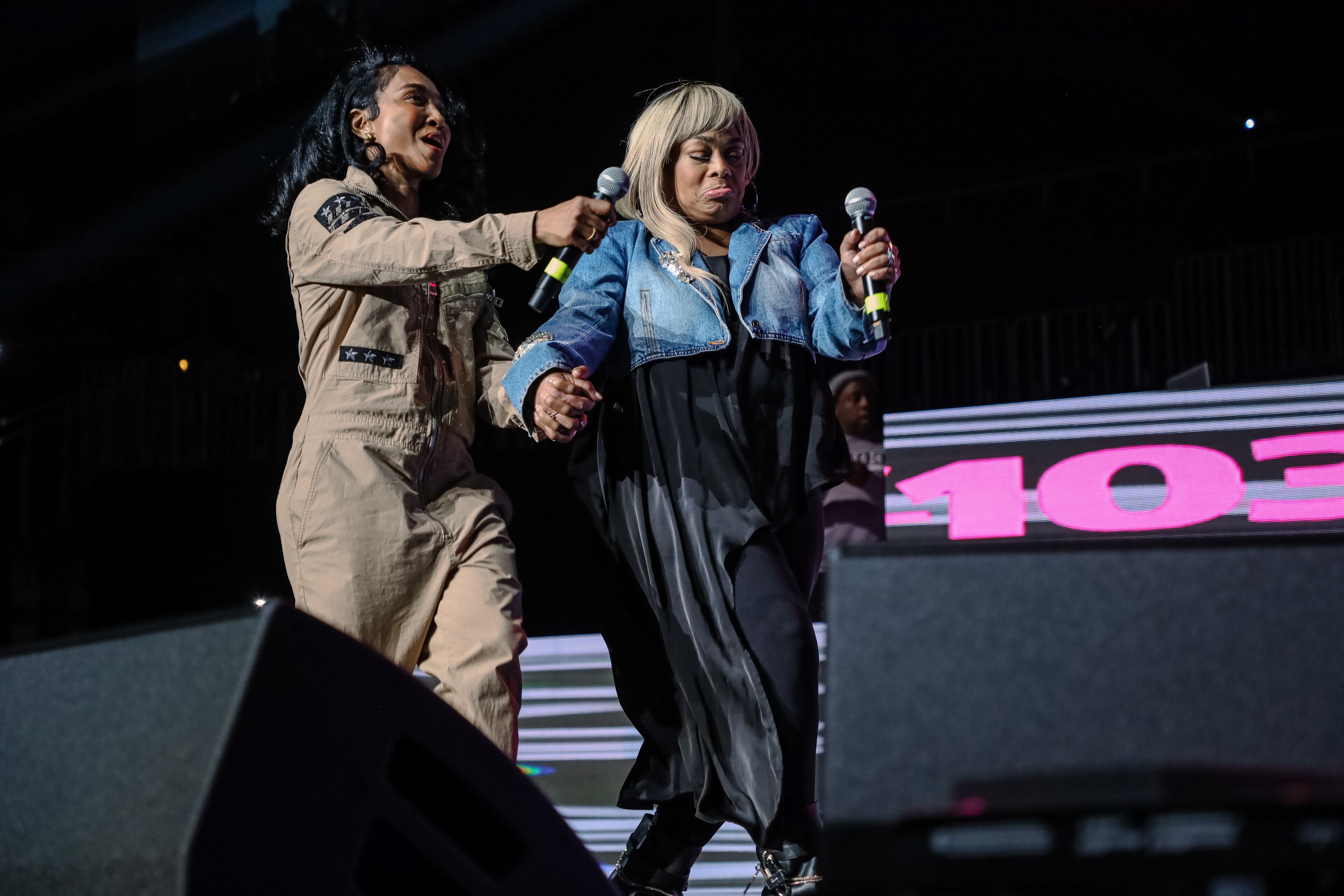 Tionne "T-Boz" Watkins and Rozonda "Chili" Thomas, members of TLC, receive the V103 People’s Award on Friday, Dec. 15, 2023, at State Farm Arena for V103’s Winterfest. (Kymani Culmer for The Atlanta Journal-Constitution)