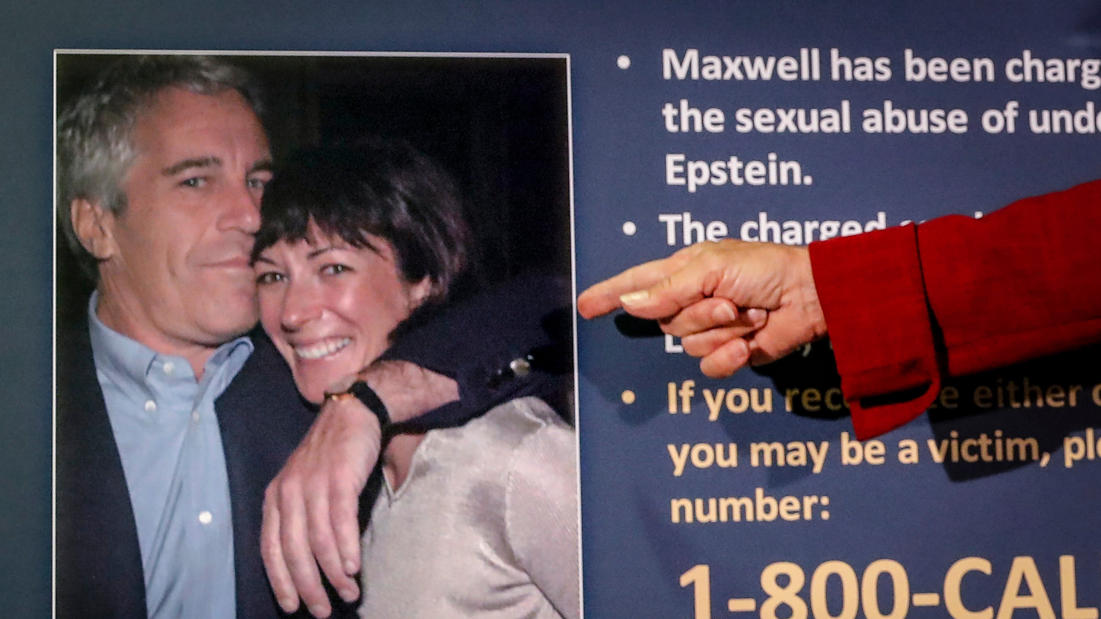 FILE - Audrey Strauss, acting U.S. attorney for the Southern District of New York, points to a photo of Jeffrey Epstein and Ghislaine Maxwell during a news conference in New York on July 2, 2020. (AP Photo/John Minchillo, File)