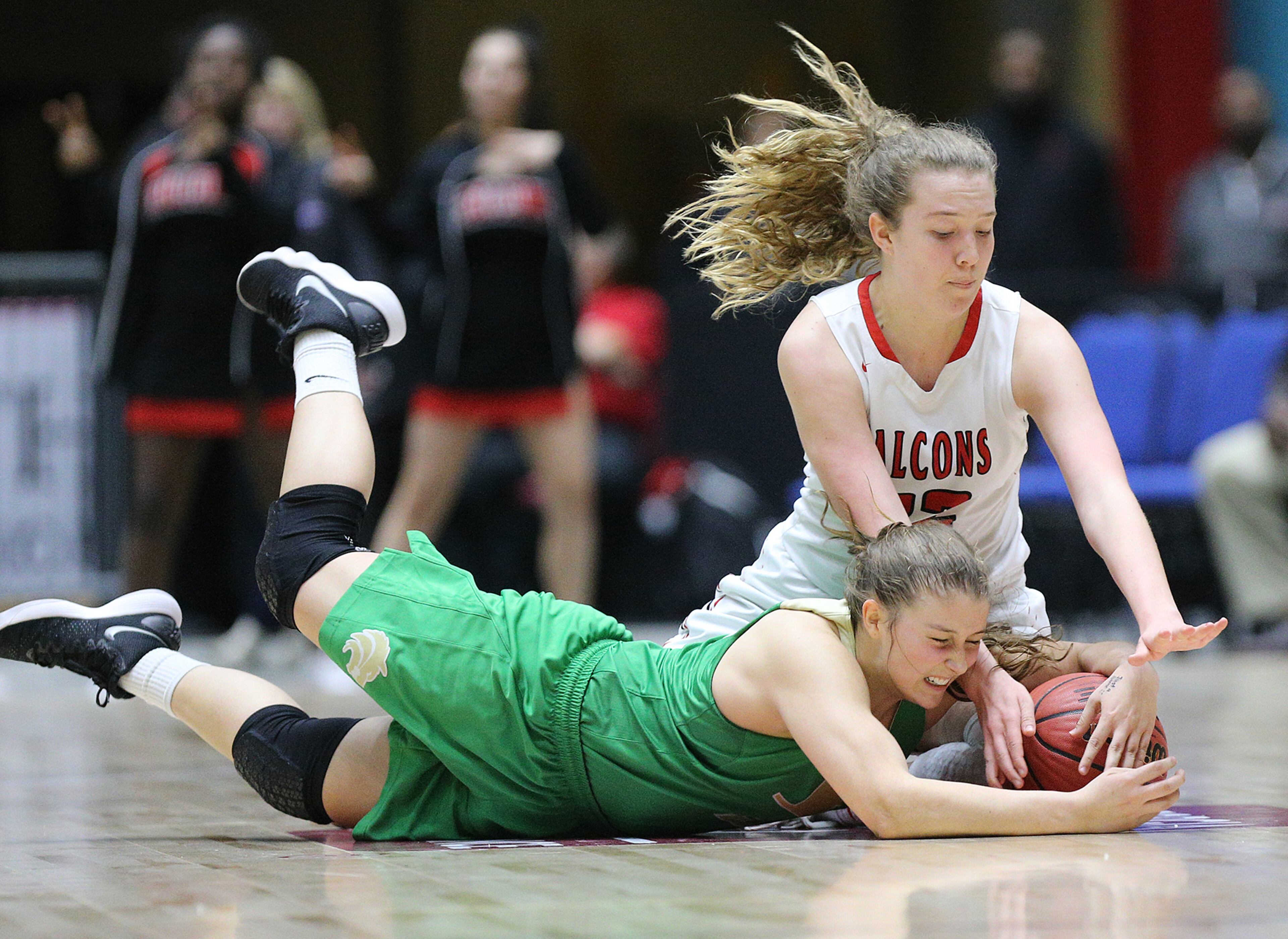 March 8, 2018 Macon: Buford guard Tate Walters dives for a loose ball against Flowery Branch player Ashlee Locke in their GHSA state basketball championship game on Thursday, March 8, 2018, in Macon. Curtis Compton/ccompton@ajc.com