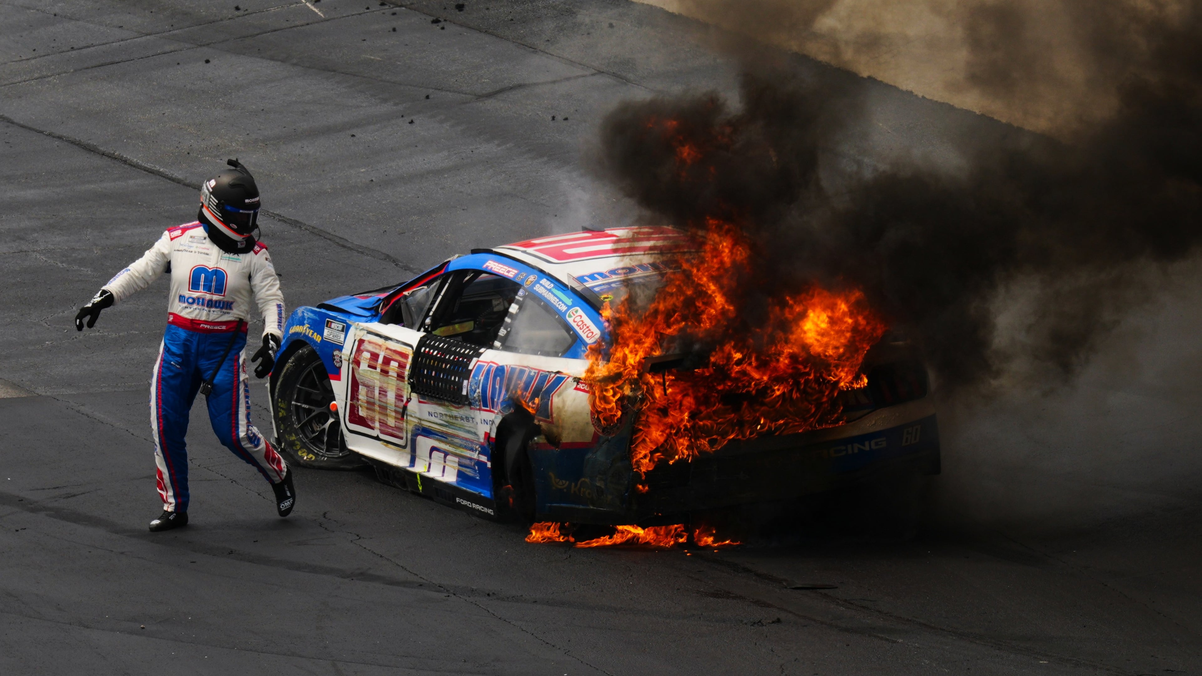 Ryan Preece escapes his burning car during the NASCAR All-Star auto race at Dover Motor Speedway, Sunday, May 17, 2026, in Dover, Del. (AP Photo/Derik Hamilton)