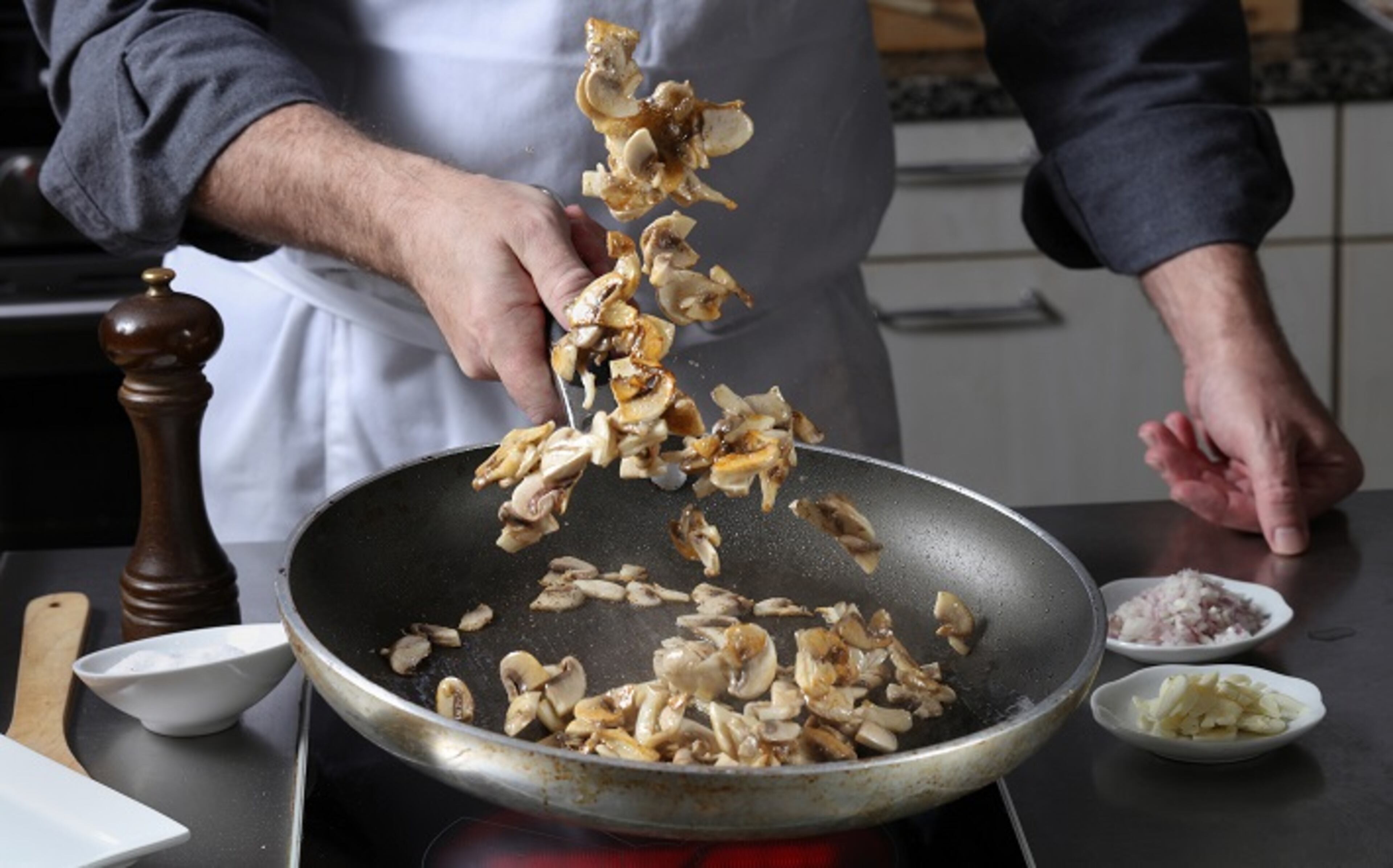 When your mushrooms are nicely seasoned and brown on the bottom, toss or stir them in the pan. (Abel Uribe/Chicago Tribune/TNS)