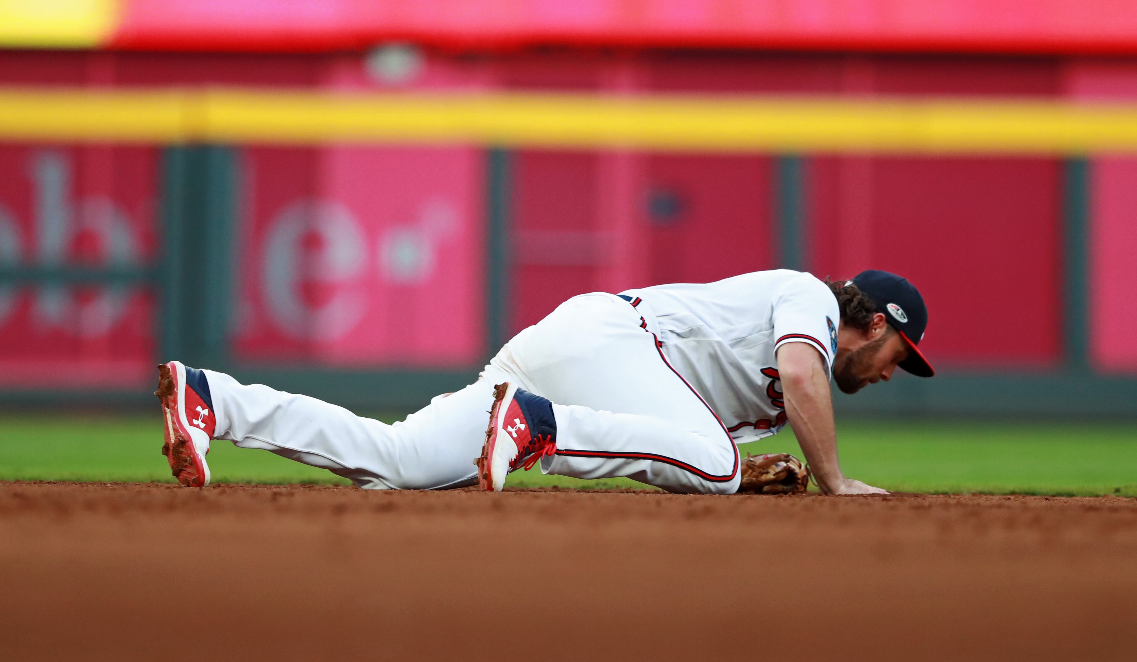 Braves shortstop Charlie Culberson couldn't make the play on David Freese's hit. (Curtis Compton/ccompton@ajc.com)