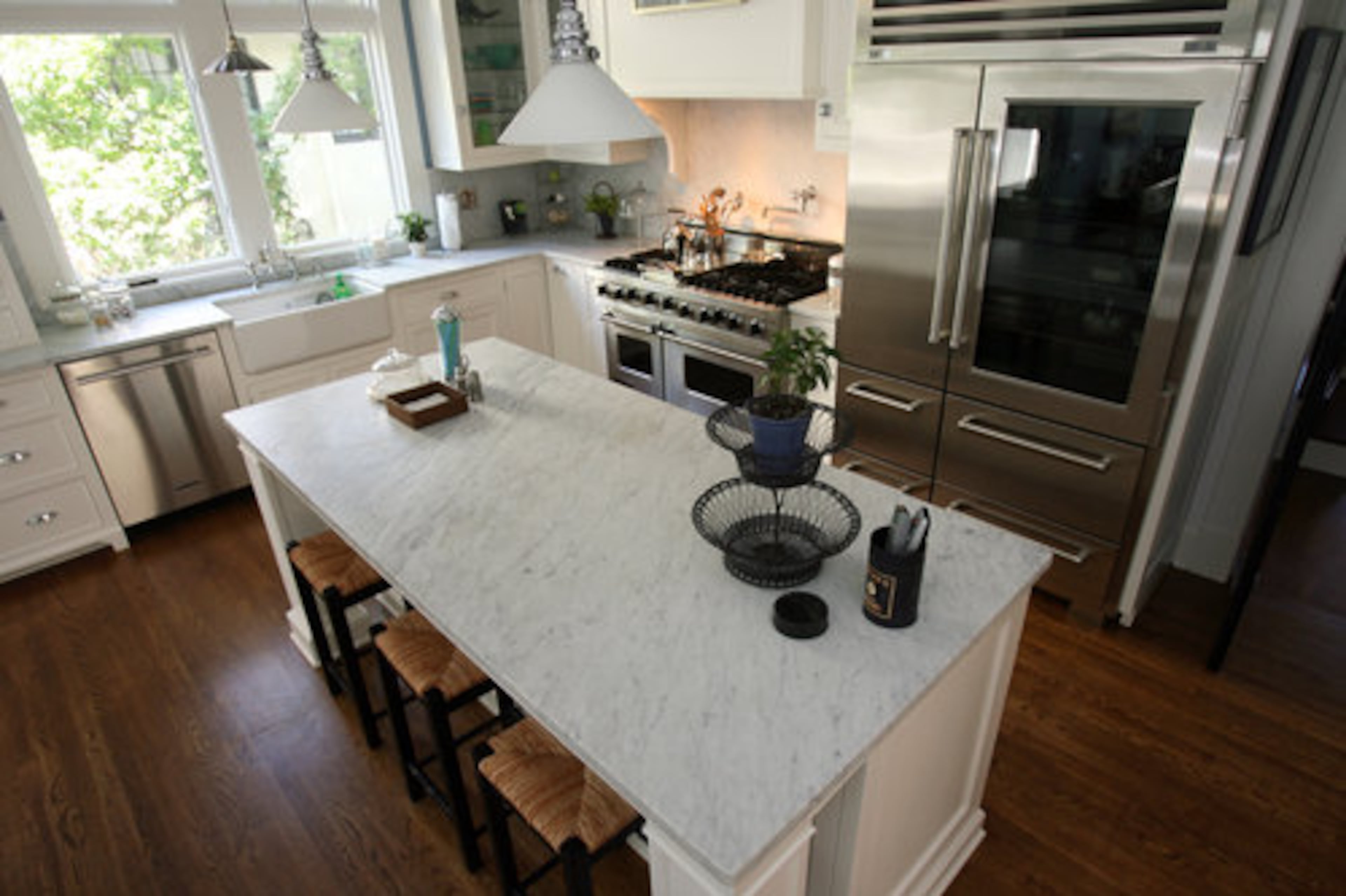 The renovated kitchen features a new stove and fridge.