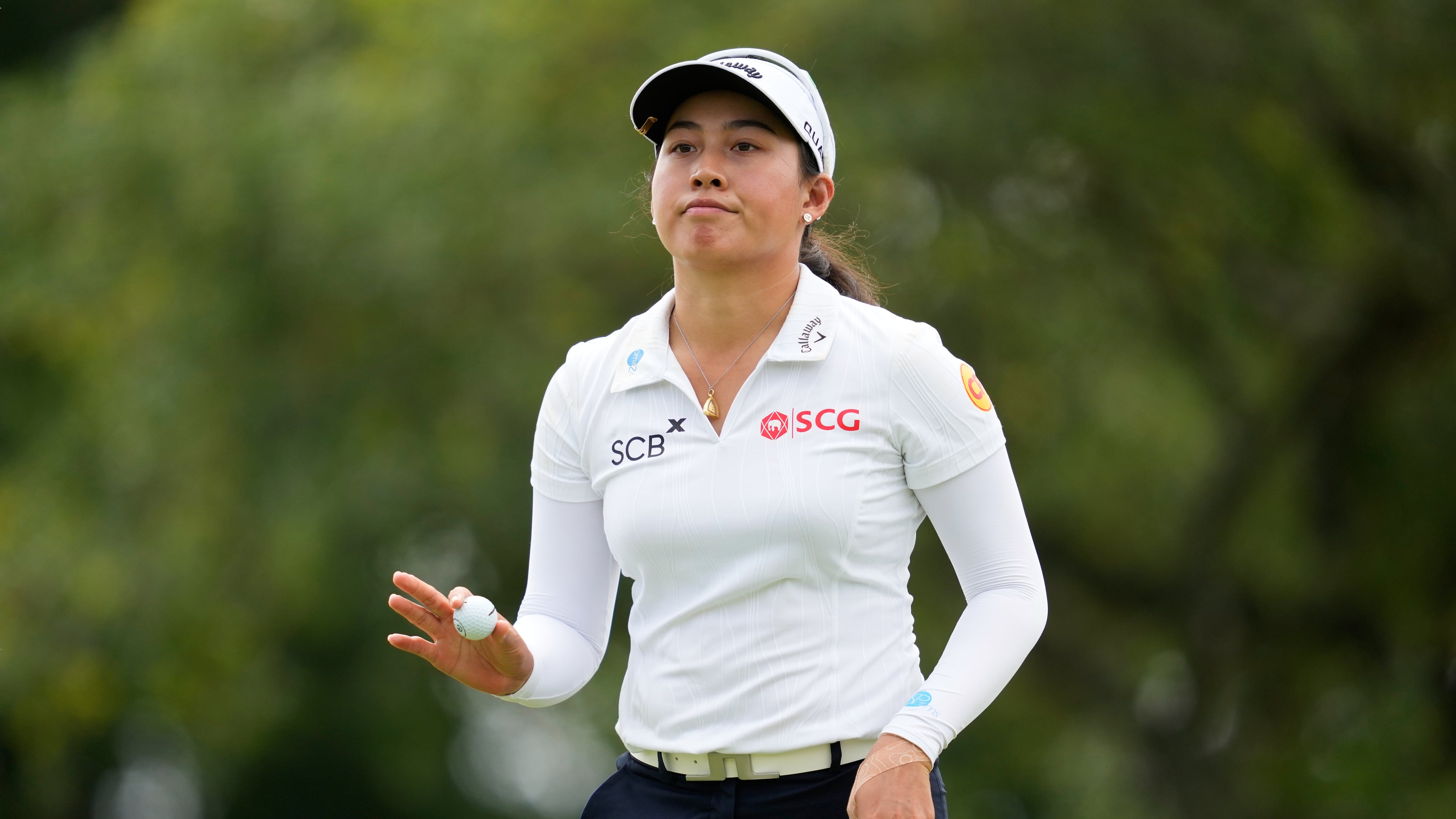 Jeeno Thitikul, of Thailand, waves after making a putt on the 13th hole during the second round of the Chevron Championship LPGA golf tournament Friday, April 24, 2026, in Houston. (AP Photo/Ashley Landis)