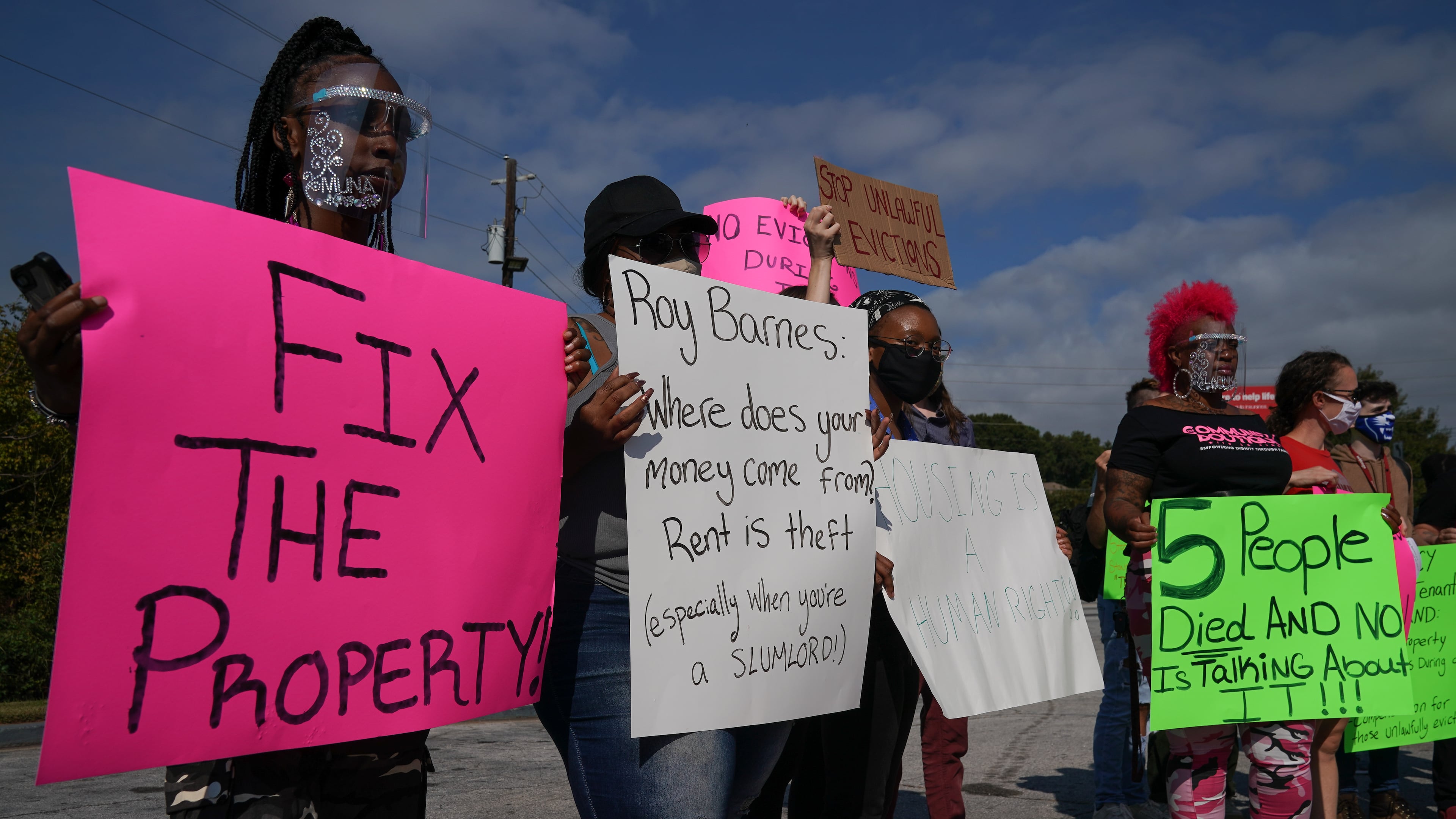 Housing rights advocates and former residents gather near the Efficiency Lodge on Flat Shoals Road for a protest on Wednesday, October 7, 2020. (Elijah Nouvelage for The Atlanta Journal-Constitution)