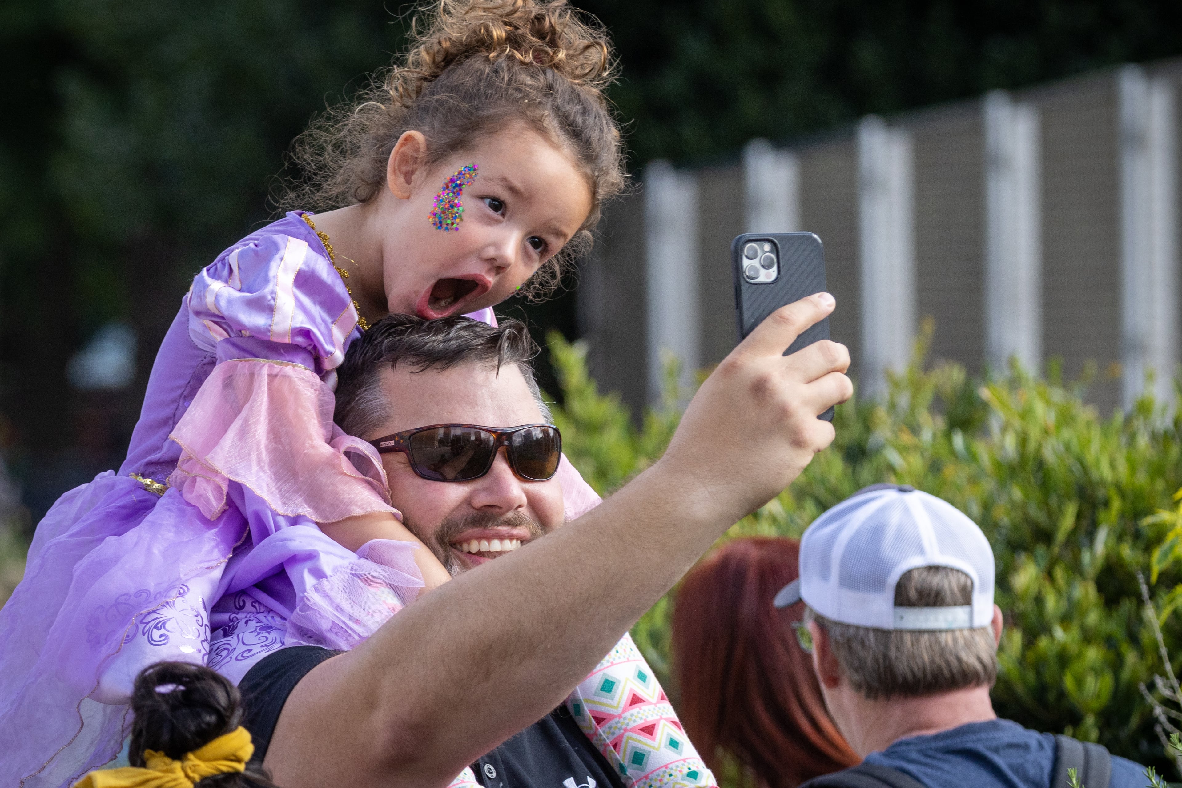 People take selfies at the beginning of the Dragon Con Parade as it moves up Peachtree Street in Atlanta on Saturday, Sept. 3, 2022. (Photo: Steve Schaefer/steve.schaefer@ajc.com)