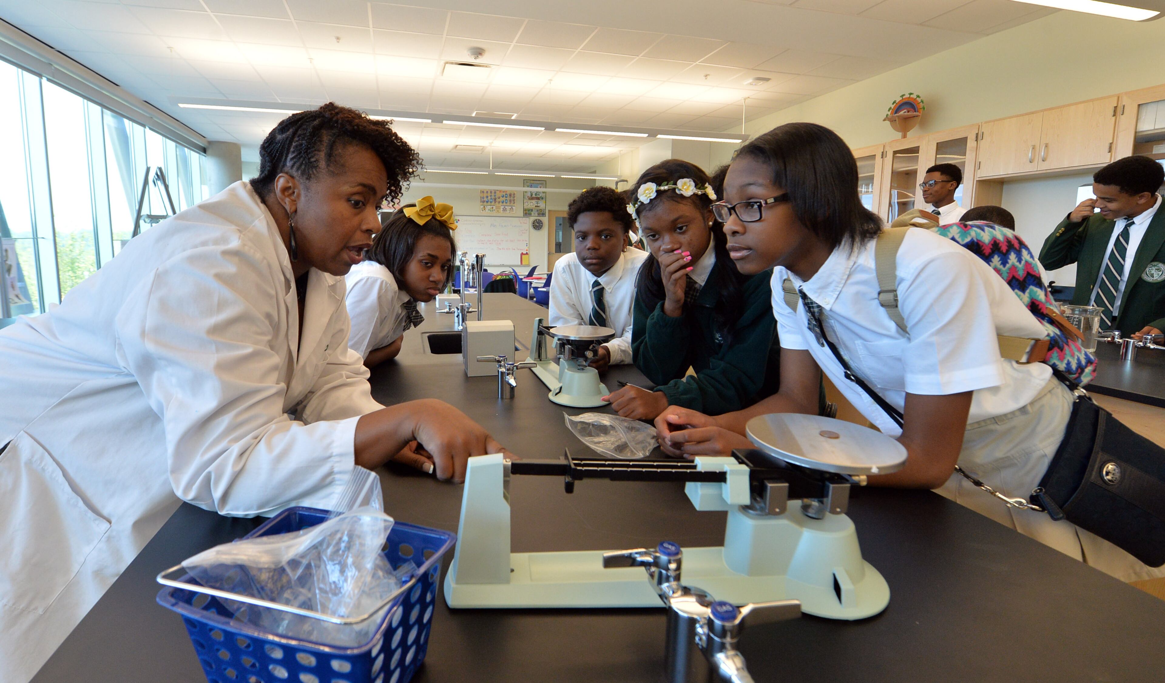 Dr. Candace Spearman directs students Kinnedy Bowers (from left), Quay Manuel, Amber Donerlson and Tamia Ross during an exercise in weight measurement Thursday.
