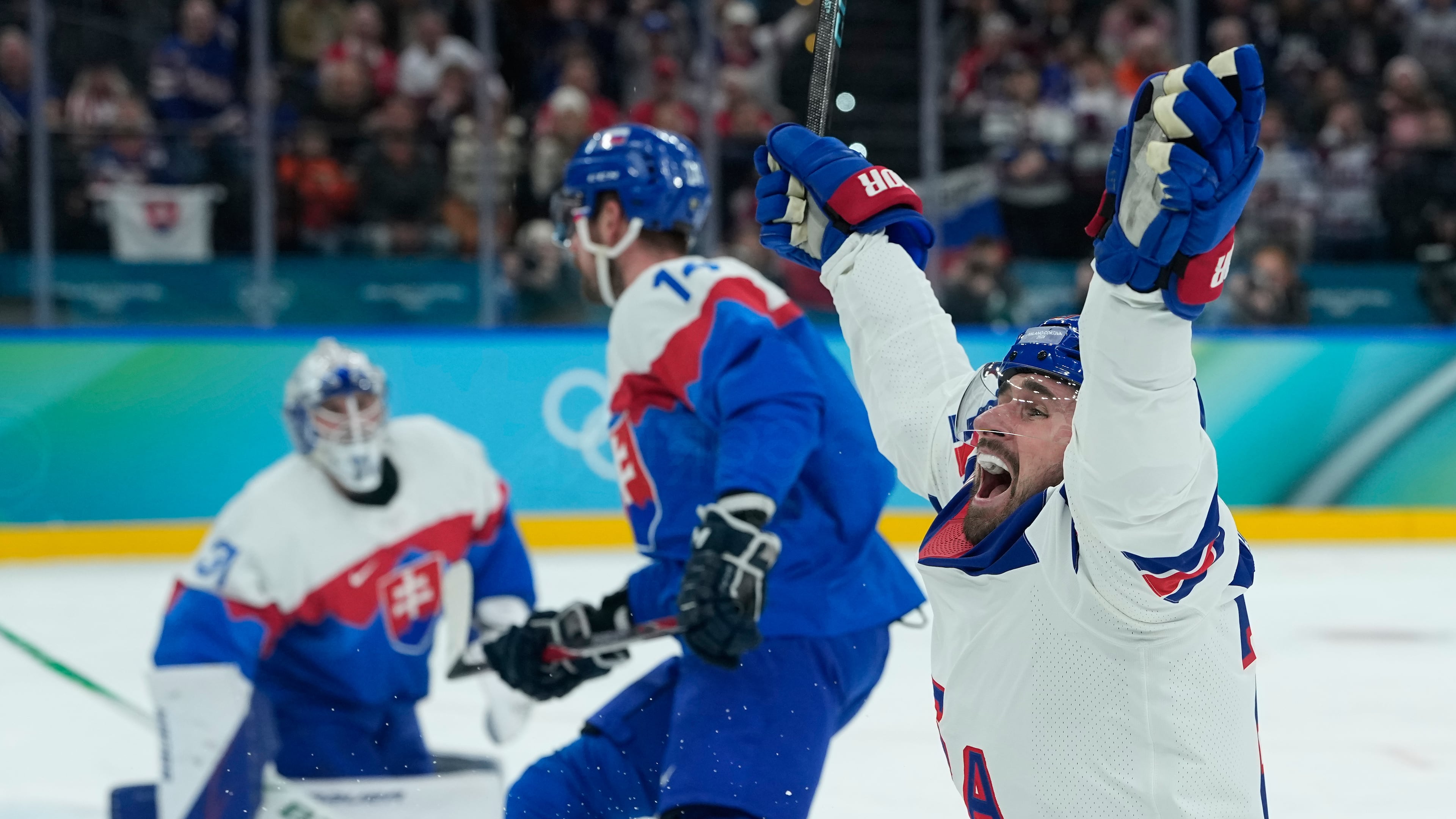 United States' Dylan Larkin (21) celebrates after scoring the opening goal during a men's ice hockey semifinal game between United States and Slovakia at the 2026 Winter Olympics, in Milan, Italy, Friday, Feb. 20, 2026. (AP Photo/Petr David Josek)