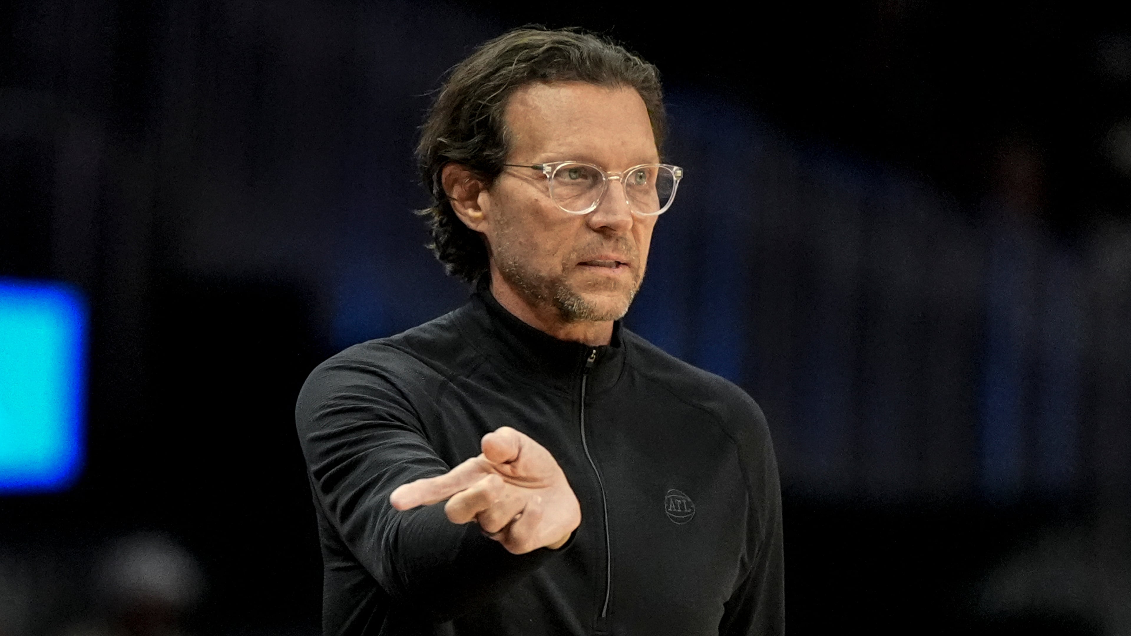 Atlanta Hawks head coach Quin Snyder speaks in the first half of an NBA basketball game against the Boston Celtics, Monday, March 30, 2026, in Atlanta. (AP Photo/Mike Stewart)