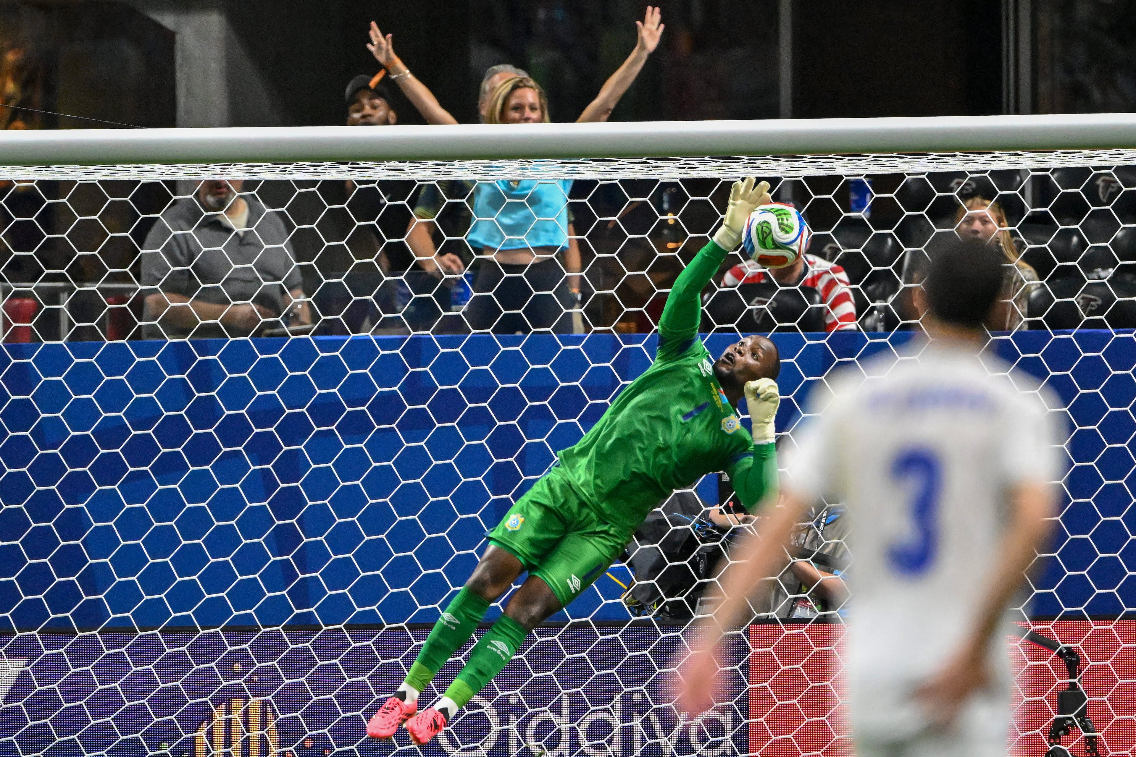 Congo goalkeeper Lionel Mpasi makes a stop against Uzbekistan during the first half of a FIFA World Cup match at Atlanta Stadium (Mercedes-Benz Stadium) on Saturday, June 27, 2026, in Atlanta. (Hyosub Shin/AJC)