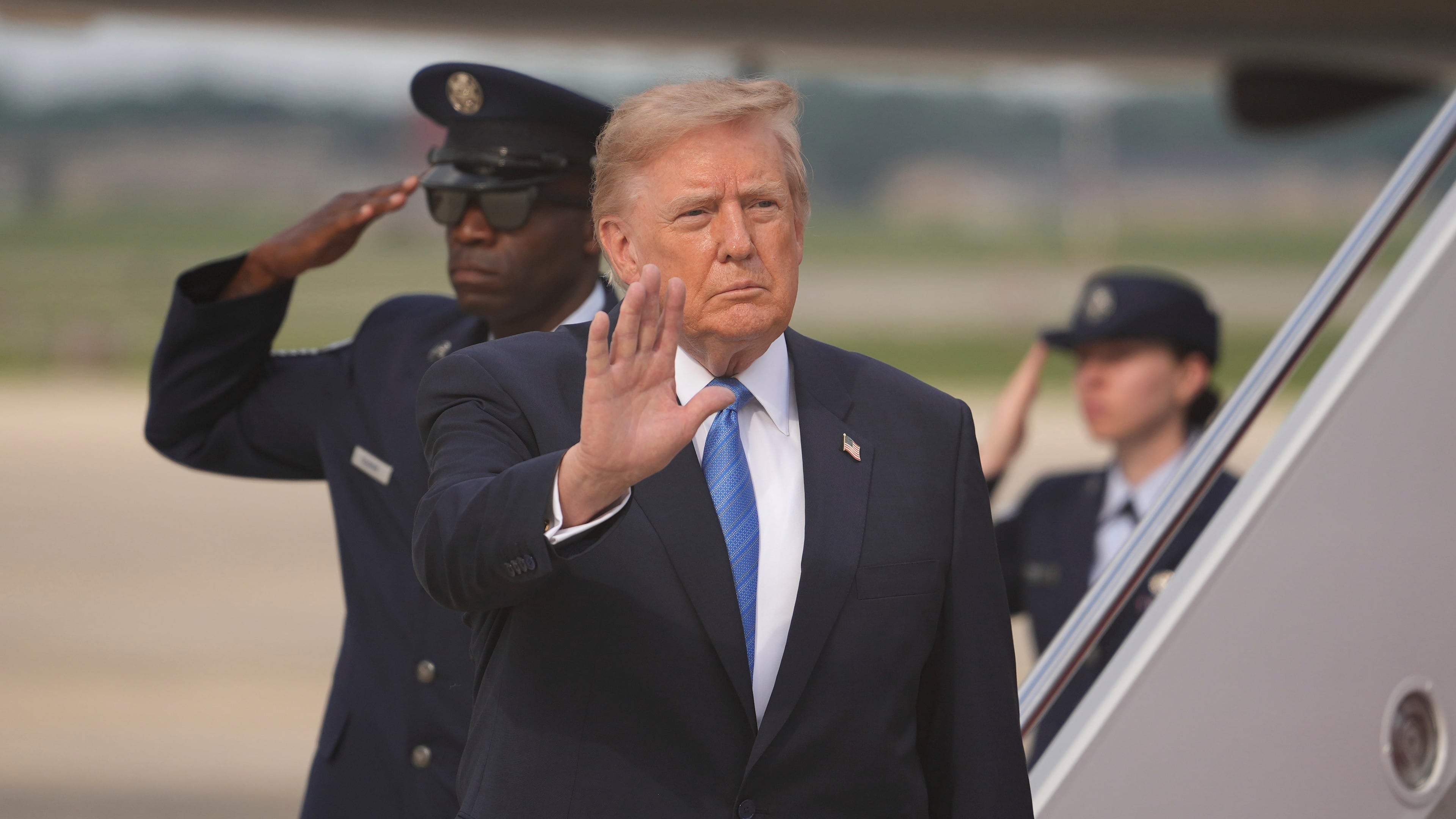 President Donald Trump waves after arriving off Air Force One, Friday, Aug. 28, 2026, at Joint Base Andrews, Md. (AP Photo/Mark Schiefelbein)