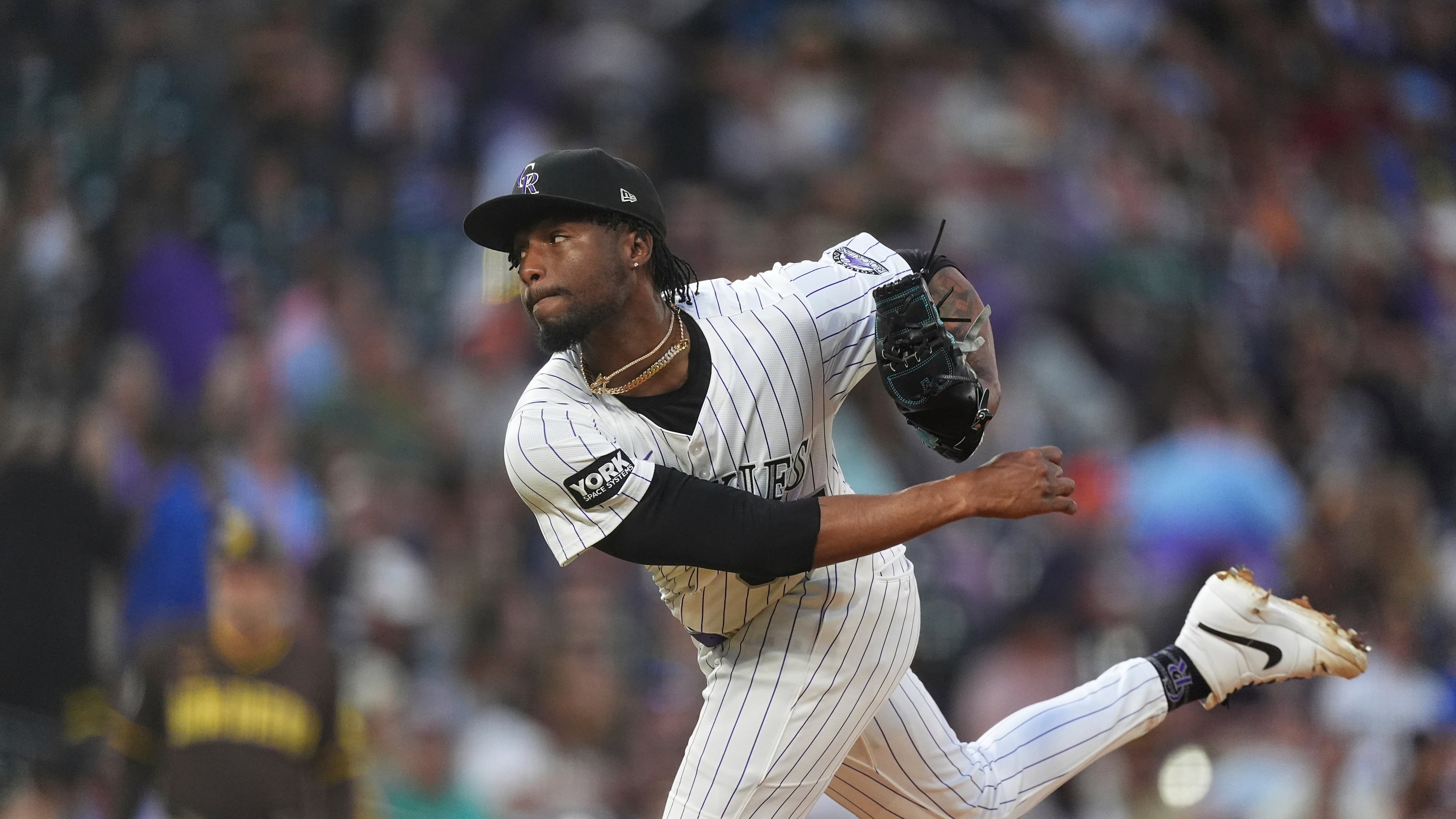 FILE - Colorado Rockies relief pitcher Angel Chivilli (57) in the fourth inning of a baseball game, Sept. 6, 2025, in Denver. (AP Photo/David Zalubowski, File)