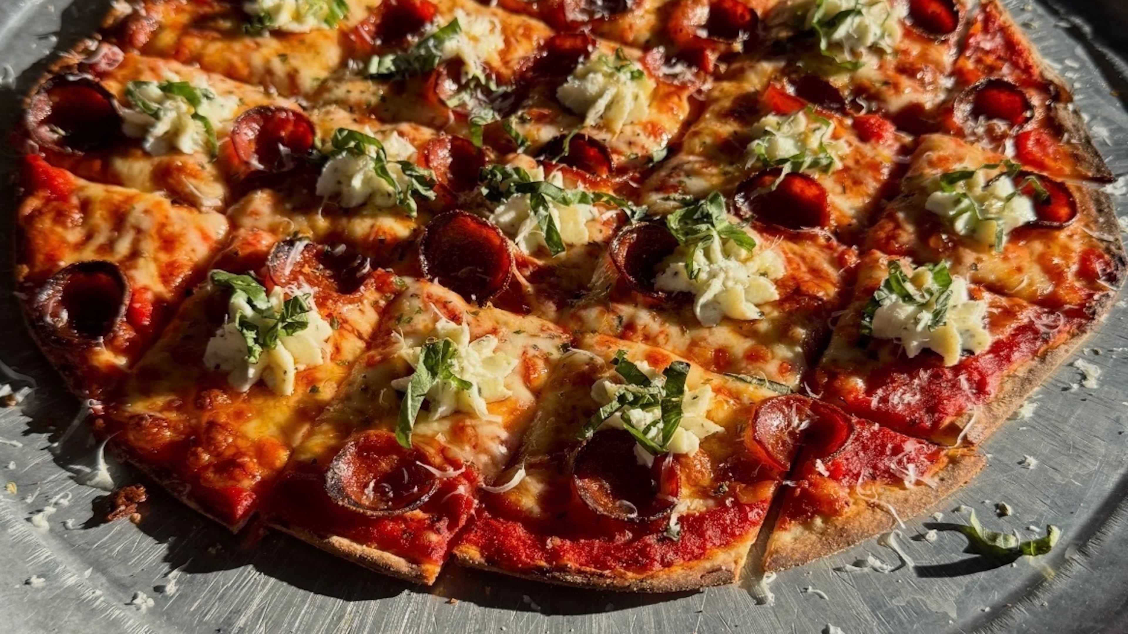 Bertolozi's offers a menu of Chicago tavern-style pizza, including the "Joyce," named after owner Danny Huber's mother. (Courtesy of Danny Huber)