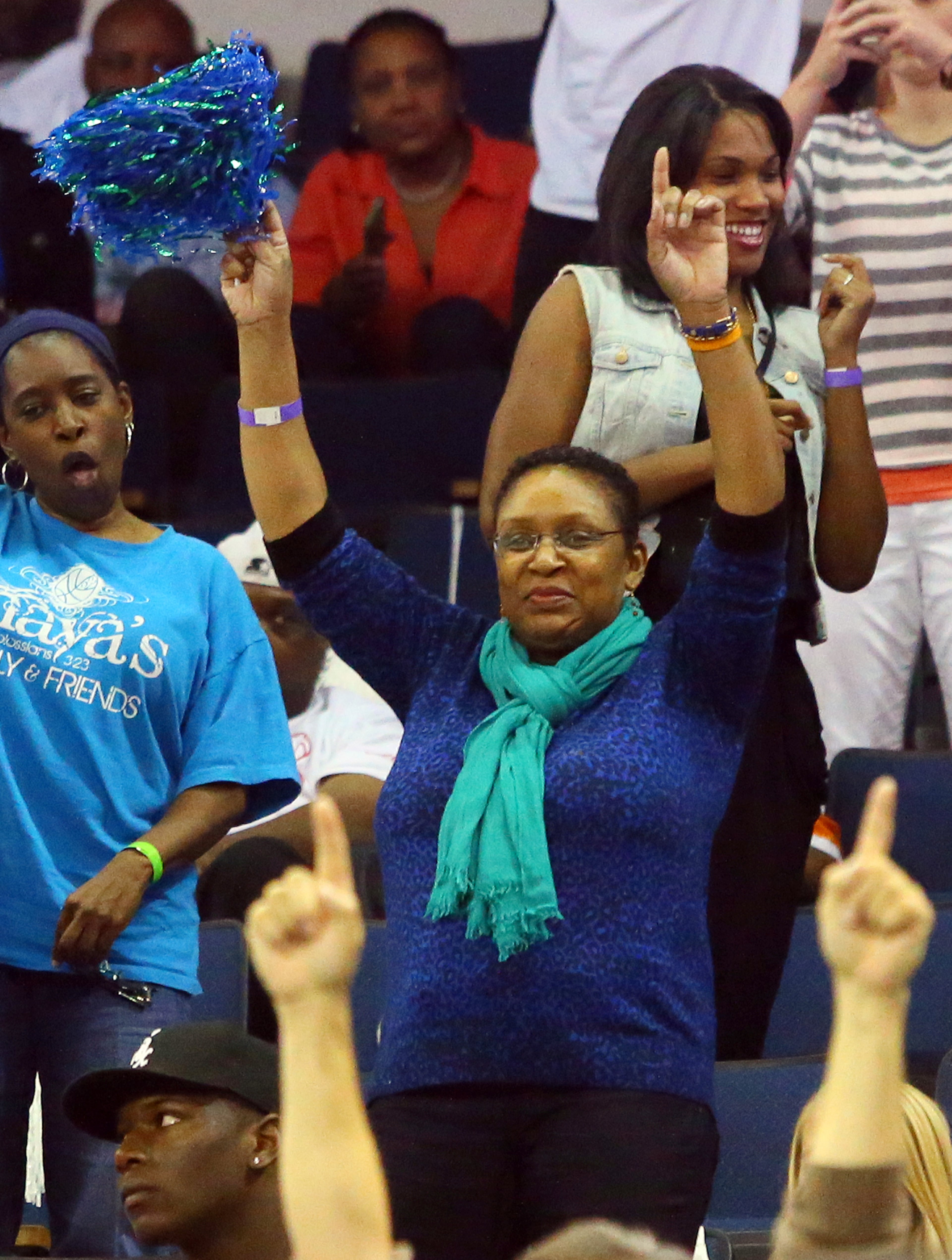 Kathryn Moore, the mother of Maya Moore, cheers for her daughter as she and the Lynx defeat the Dream 86-77 to win the WNBA Championship on Thursday, Oct. 10, 2013, in Duluth.