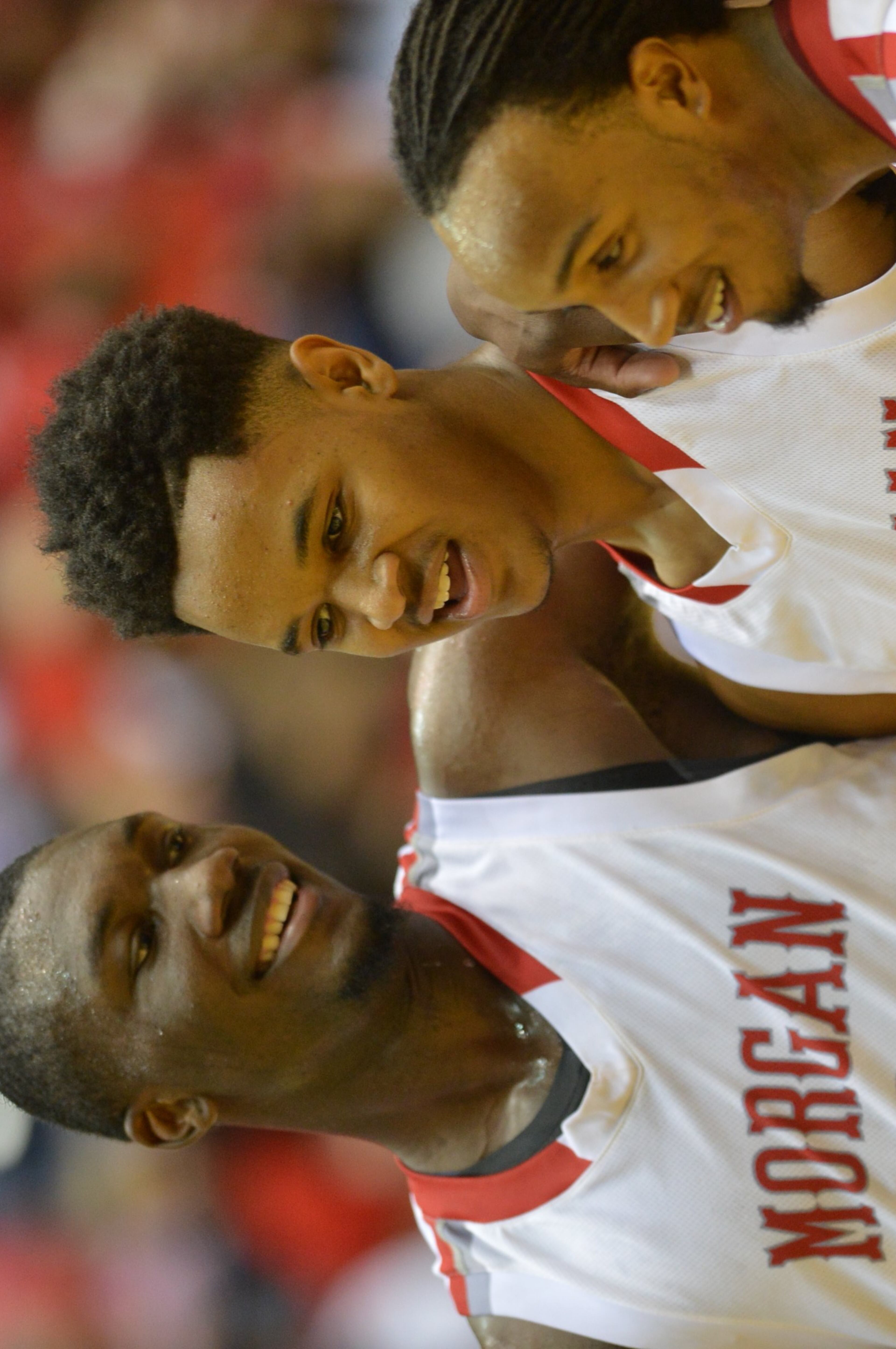 Morgan County Bulldogs C.J. Thurman #1, Jailyn Ingram #15 and Davon Gibbs #12 start to celebrate late in the 4th quarter. Coverage of the Class AAA boys basketball championship between the Buford Wolves and Morgan County Bulldogs at the Macon Coliseum Saturday, March 8, 2014. Morgan County won handily, beating the Buford Wolves 69-45.