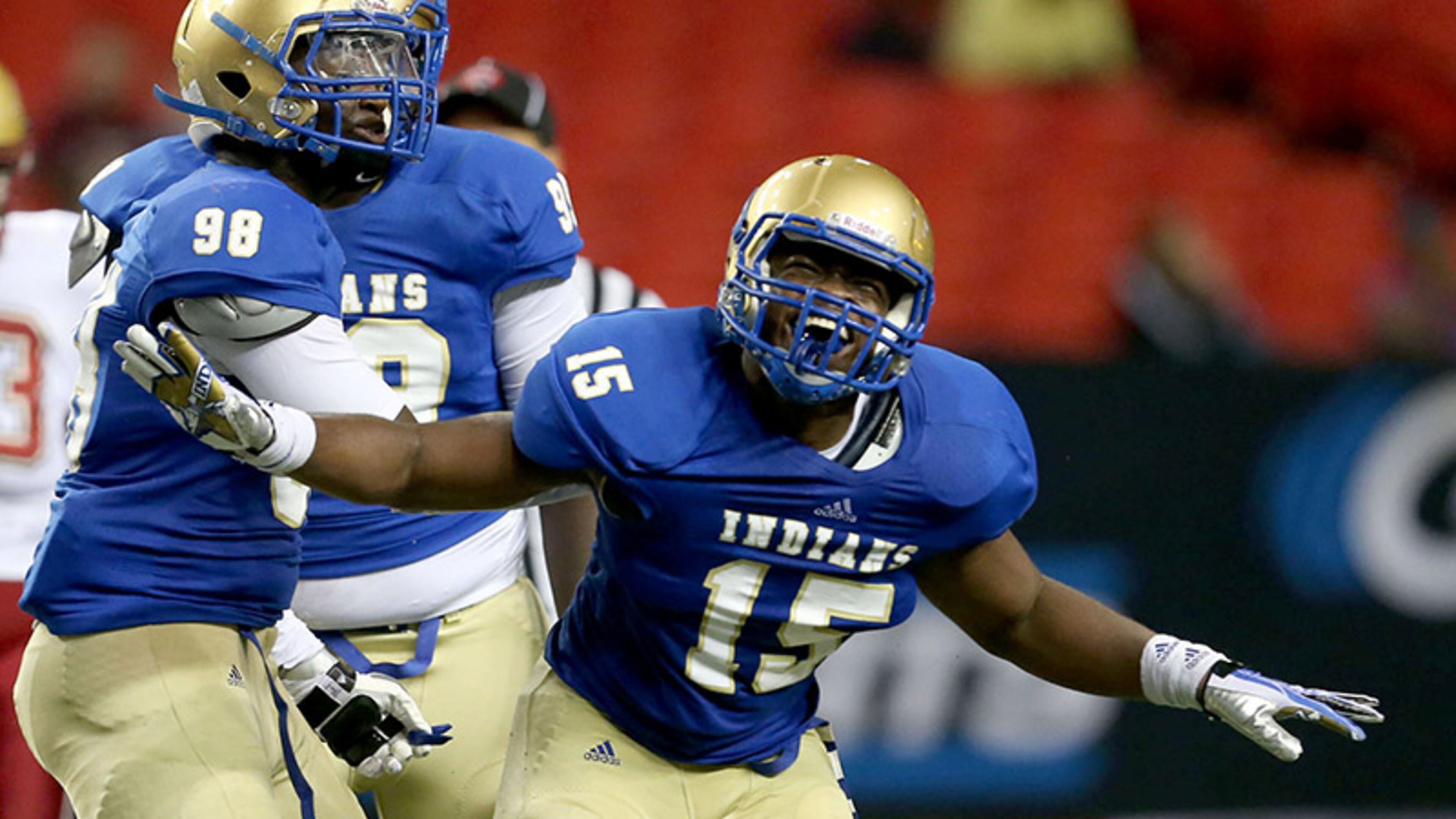 McEachern defensive end Henry Famurewa (15) celebrates his sack of Brookwood quarterback Joey McLane.