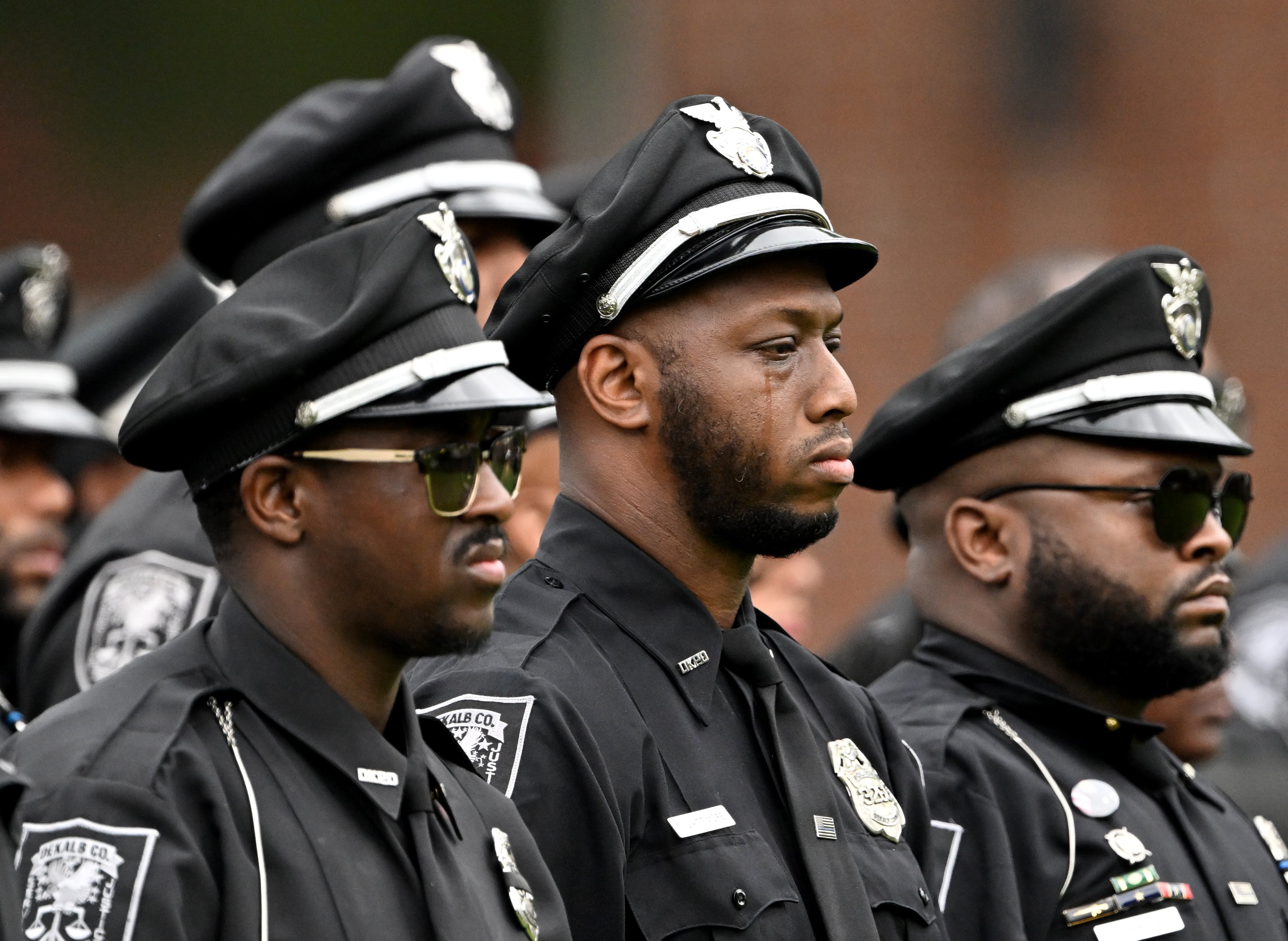 A DeKalb County police officers attend the Final Honors following the memorial service for DeKalb County police Officer David Rose, who was killed while responding to the Aug. 8 shooting at the CDC, outside the First Baptist Church Atlanta on Friday, Aug. 22, 2025. (Hyosub Shin/AJC)