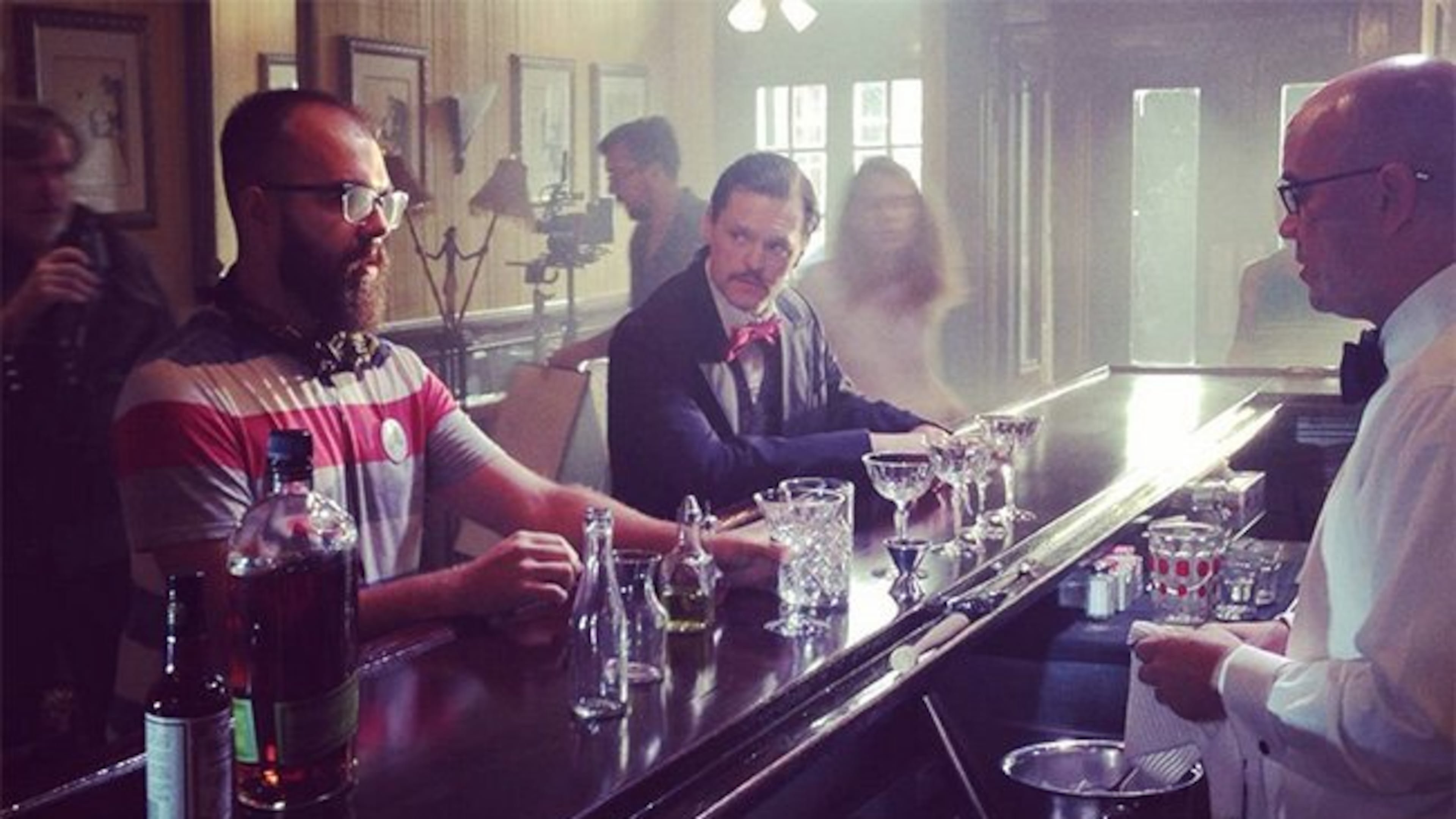 Director James Martin discusses the opening scene of Sazerac with actor Jeff Hallman and bartender, Chris Hannah at New Orleans' famous Arnaud's French 75 bar. / Photo by Four x Productions