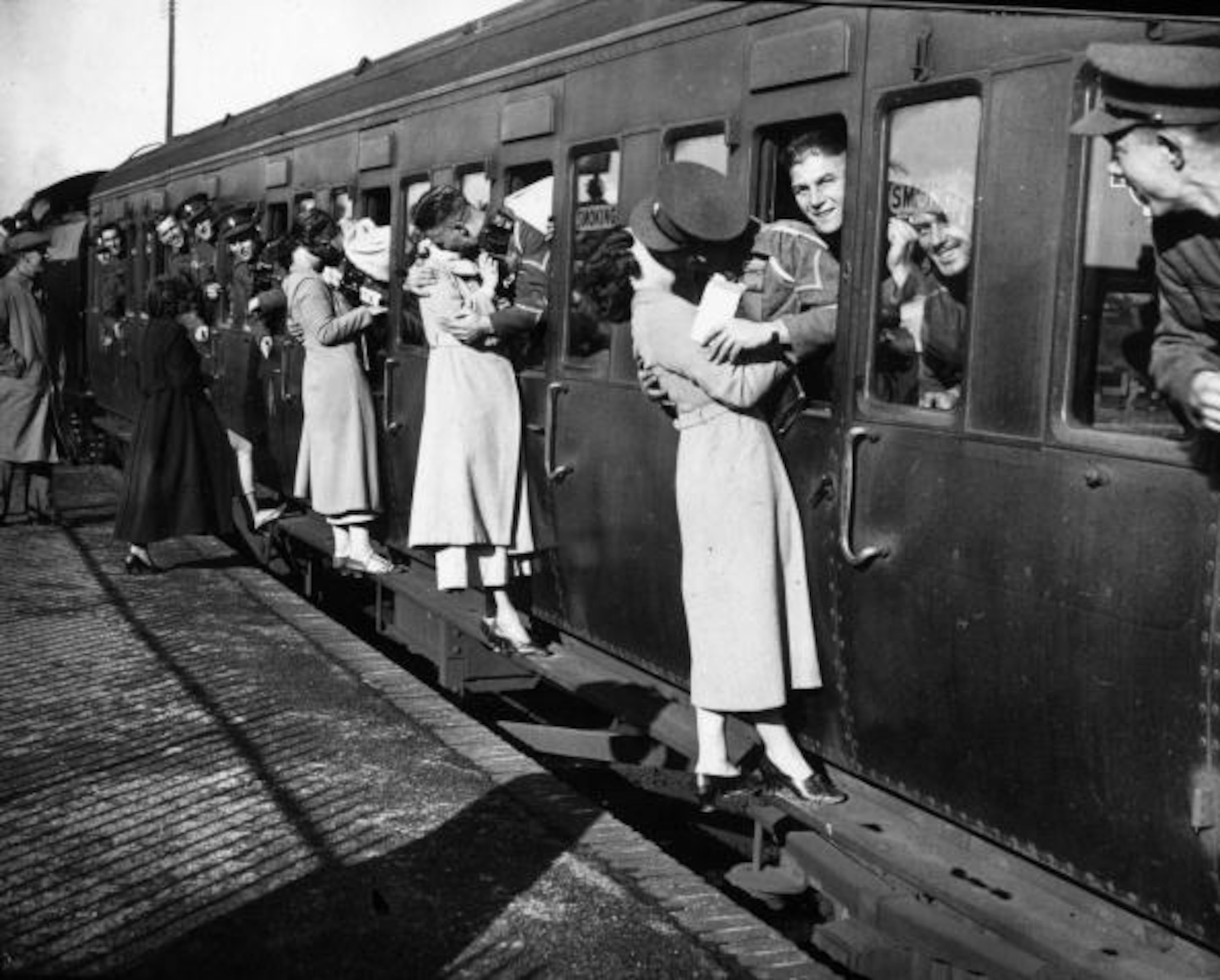 Soldiers kissing their sweethearts goodbye on Sept. 18, 1935 as troops leave for Egypt from Feltham Station. (Photo by E. Dean/Topical Press Agency/Getty Images)